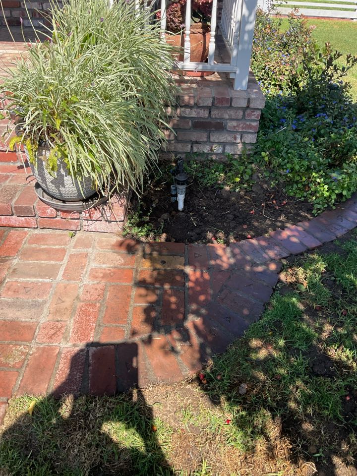 Repaired broken sprinkler line.