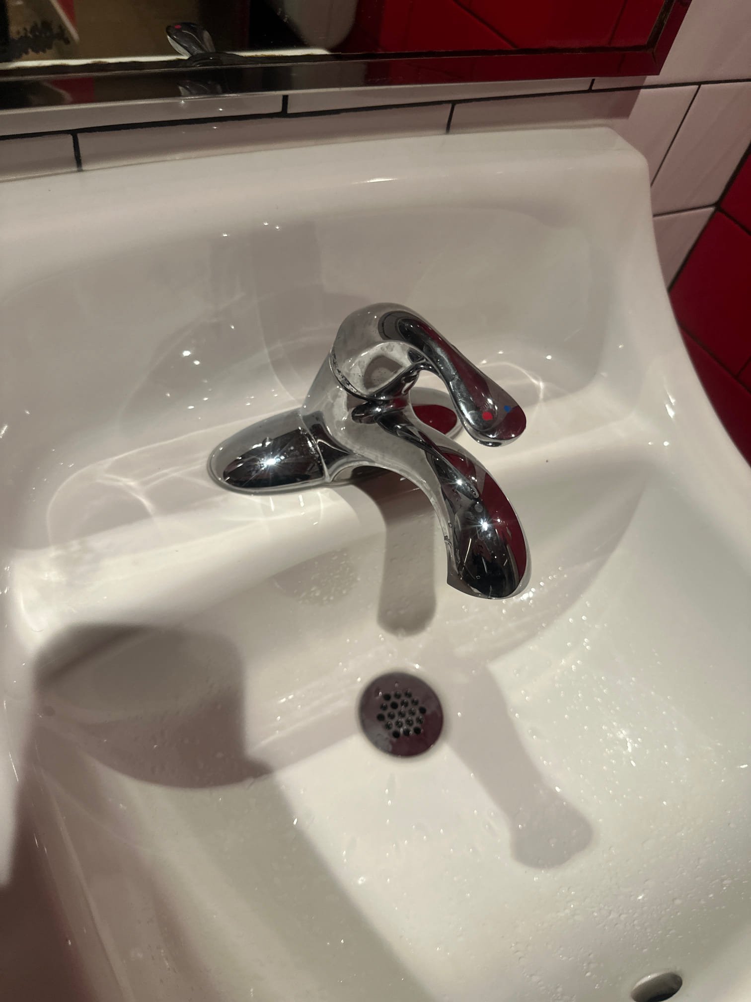 Upon arrival, I inspected two Navien tankless water heaters, confirming they were operating correctly. Four out of seven hand washing sinks, two lav faucets, and two hand sinks were receiving hot water, while the remaining three were not. After further inspection, I identified two mixing valves. One, located about 12 feet up, controls the sinks with hot water. The other, positioned 14 feet up, affects the three sinks without hot water. Adjusting the latter valve restored hot water to the affected sinks. Additionally, I fixed a leak in a hand sink by securing a plastic nut on the trap assembly, stopping the leak. I also spoke with the manager, Derek.