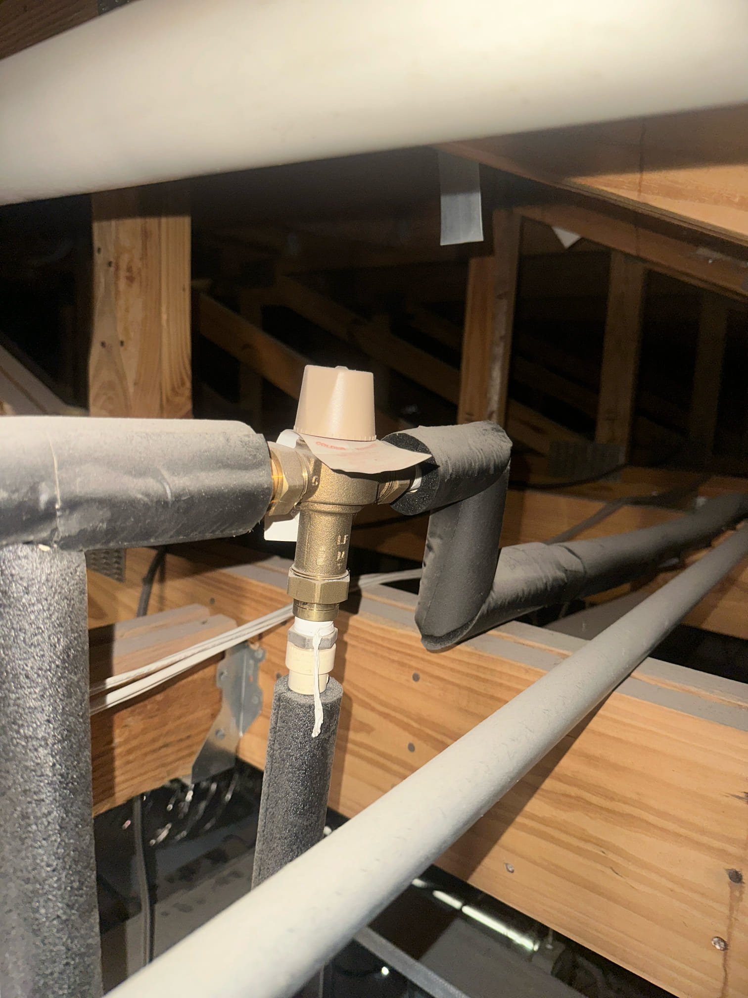 Upon arrival, I inspected two Navien tankless water heaters, confirming they were operating correctly. Four out of seven hand washing sinks, two lav faucets, and two hand sinks were receiving hot water, while the remaining three were not. After further inspection, I identified two mixing valves. One, located about 12 feet up, controls the sinks with hot water. The other, positioned 14 feet up, affects the three sinks without hot water. Adjusting the latter valve restored hot water to the affected sinks. Additionally, I fixed a leak in a hand sink by securing a plastic nut on the trap assembly, stopping the leak. I also spoke with the manager, Derek.