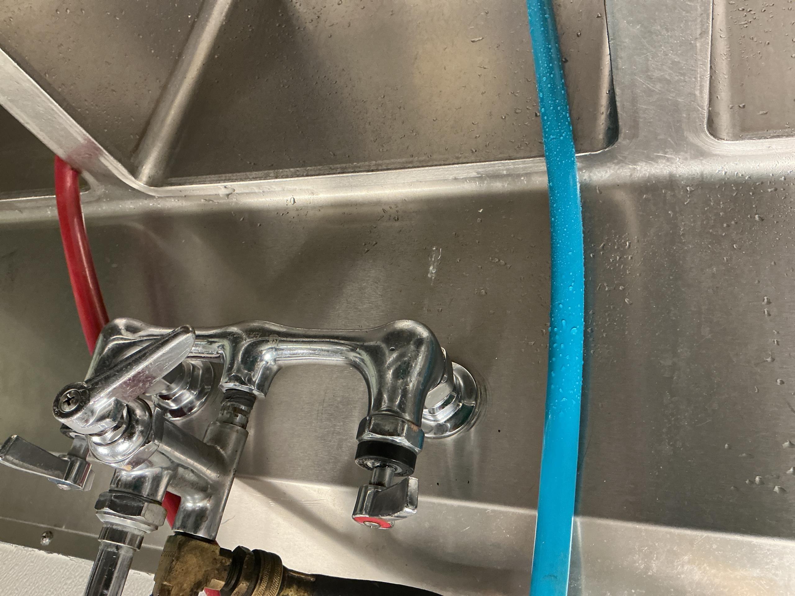 Upon inspection, I identified a leak originating from the hot water side of the three-component faucet union. I carefully tightened the connection to rectify the issue, ensuring it was secure and leak-free. Throughout the process, I maintained communication with Manager Trey, who was present on site to oversee the work. The repair was completed efficiently, restoring the faucet's functionality.