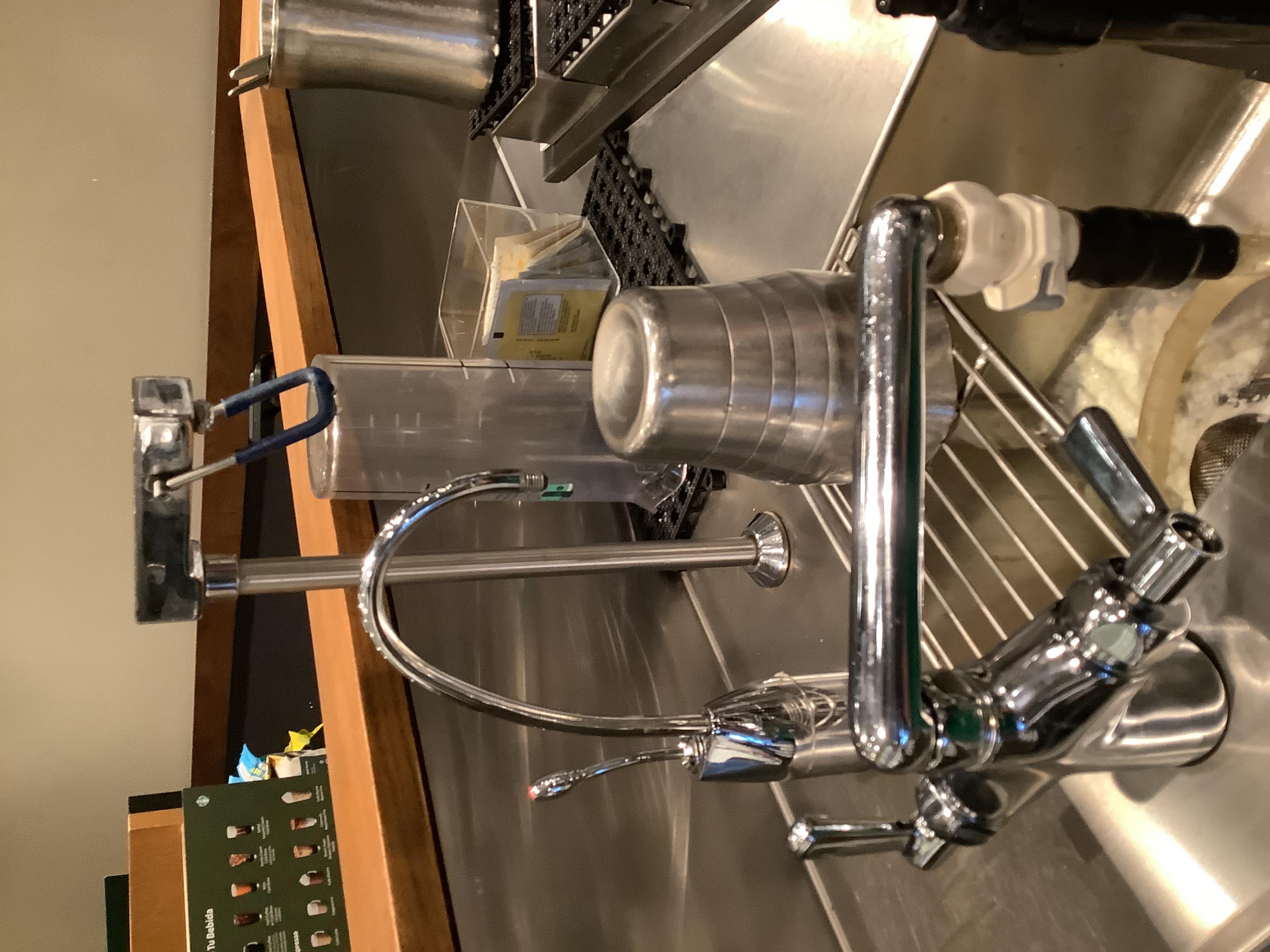 Upon arrival, I began by examining the faucets, which were equipped with aerators. I inspected the left instant hot faucet, which had been recently installed. I carefully checked the aerator and ensured it was functioning properly. Next, I moved on to inspect the water heater and its associated filters. I found everything to be in good working condition, with no signs of wear or damage. The water heater was operating efficiently, and the filters were clean and free from debris. Overall, the inspection confirmed that the system was in excellent condition.