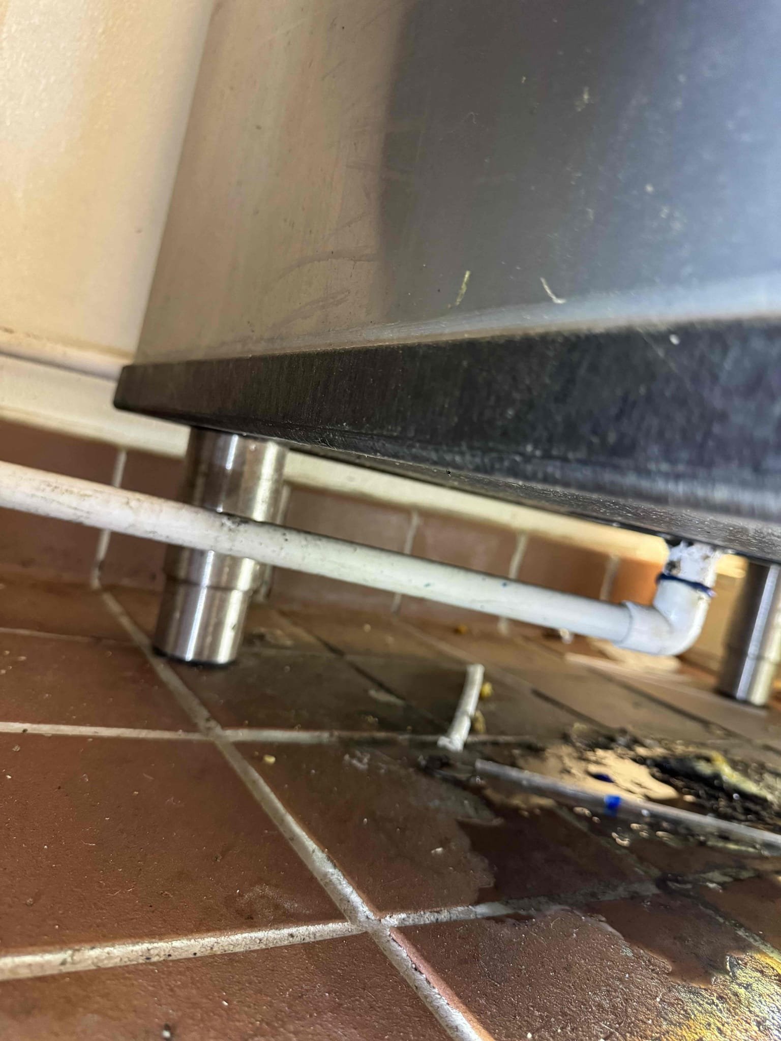 Upon arrival, I identified that the ice machine drain had detached from its glued position. I carefully reattached the drain to the machine using a high-quality adhesive, ensuring a secure bond. This repair restored proper drainage, preventing ice water from pooling. The machine is now functioning correctly, with water efficiently draining into the designated floor drain. The job was completed to satisfaction, and I confirmed the resolution with Alexis.