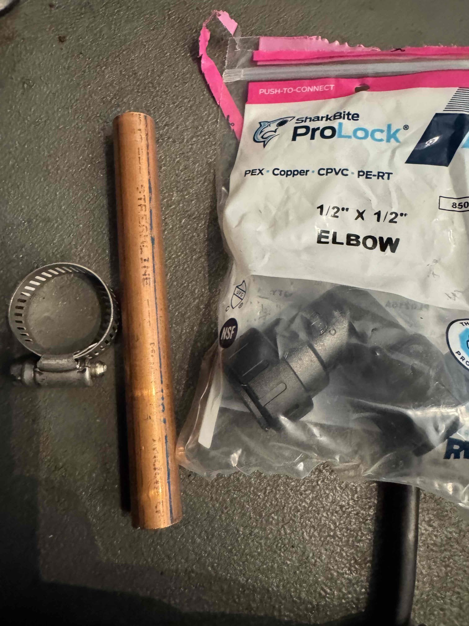 Upon inspection, the espresso machine drain was found to be too short, posing a risk of leaks. To rectify this, I extended the drain using 2 feet of 1/2-inch copper tubing. I then installed a 1-1/2x1-1/2 plastic shark bite 90-degree fitting to ensure a secure connection. Finally, I secured the assembly with a 1-inch hose clamp to prevent any future disconnections. This solution guarantees that the drain will no longer come loose, effectively preventing leaks.