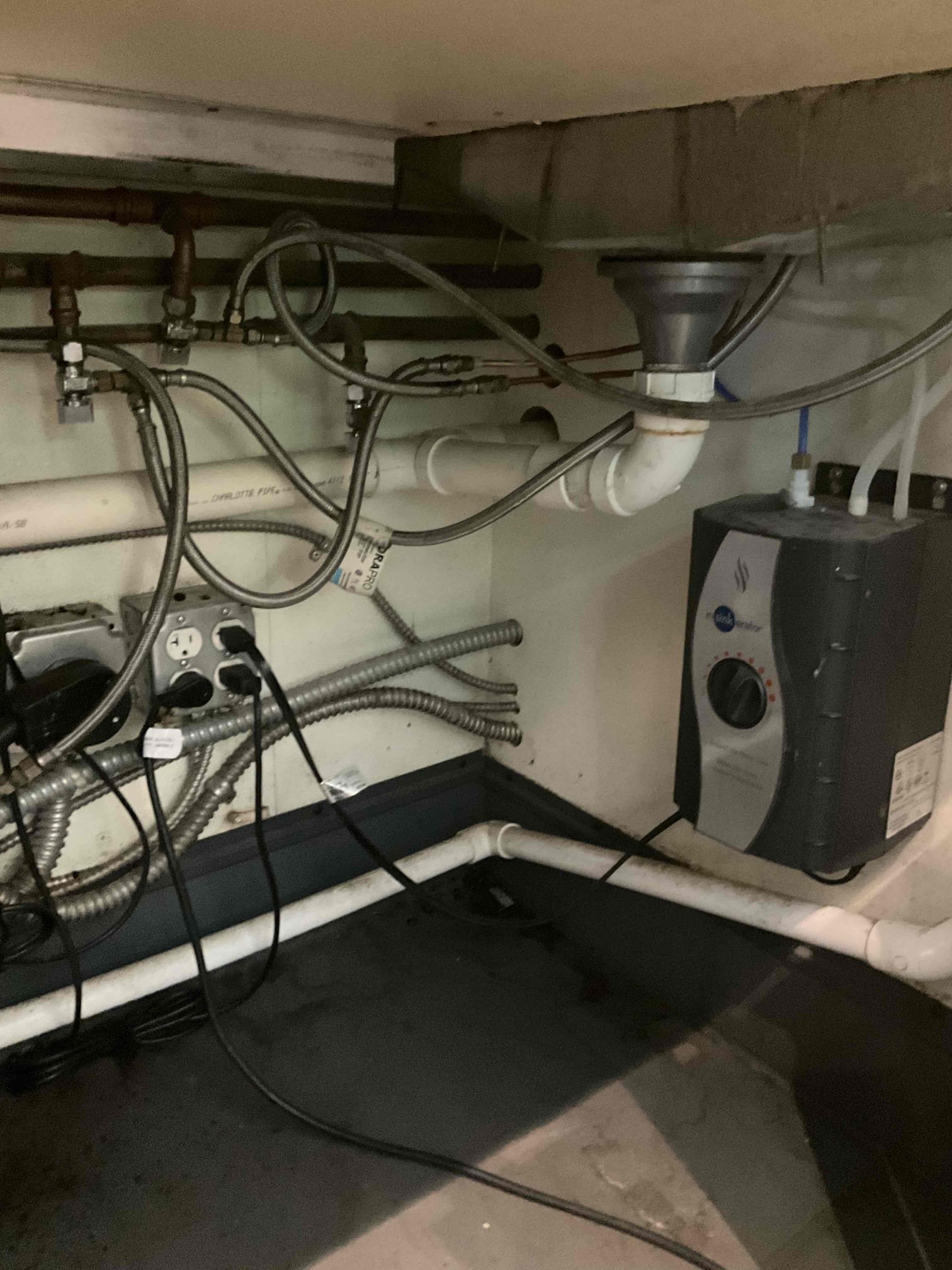 On 5/29, I addressed a foul odor from the Rhino rinse sink drain assembly for bars 2 and 3. After using glug cleaner, the drain was not fully cleaned. I recommended returning after hours to jet out the 1-1/2” PVC drain assembly. On 6/11, I removed all obstructions, inspected the drainage pipe, and used a camera to locate debris. I cleared the debris, flushed the system with additional glug cleaner, and followed with hot water until the floor sink drain basket output was clear.