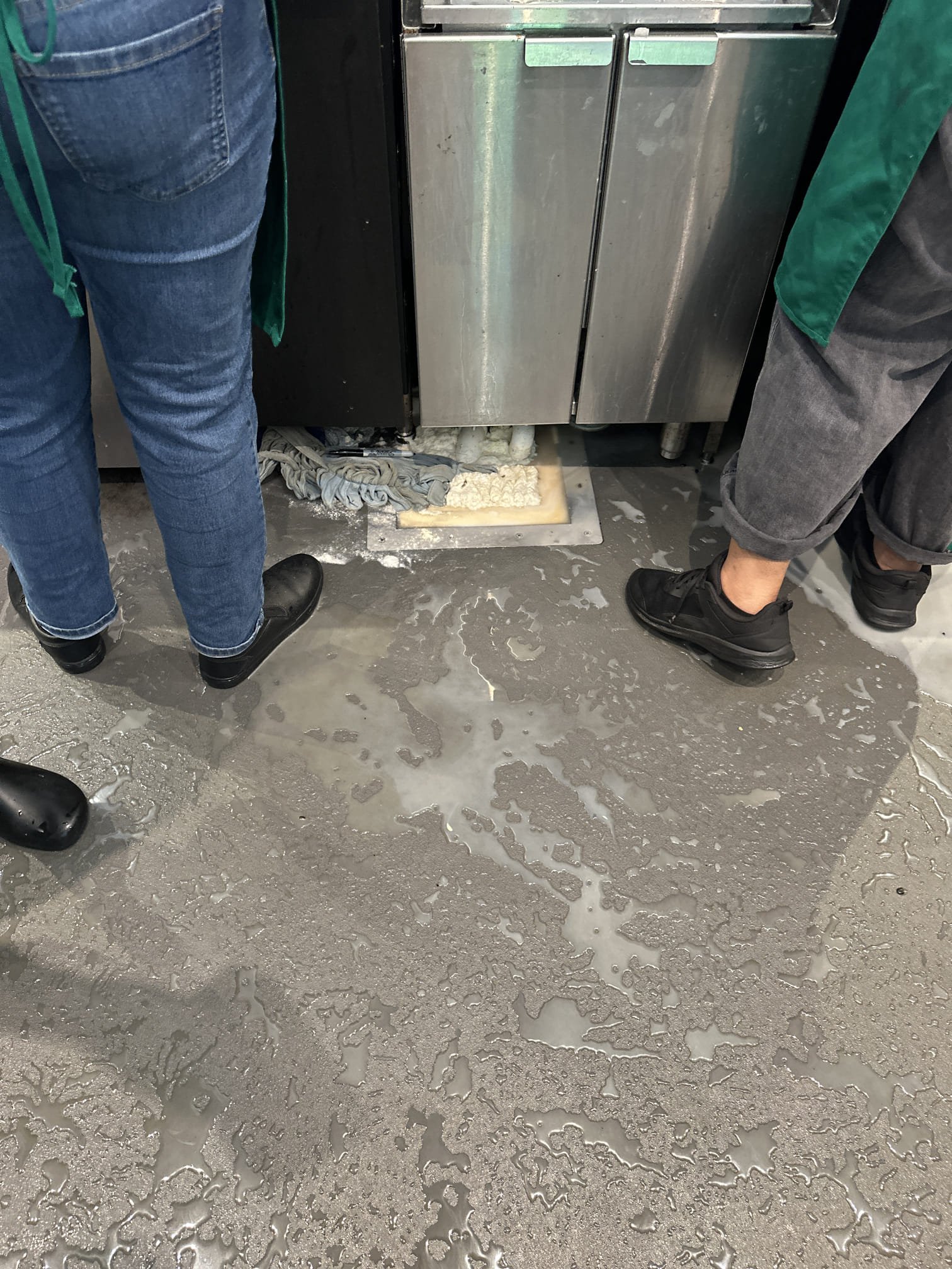 Upon arrival, I met with the manager, Jennifer, who reported a flooding issue caused by a floor sink under the espresso machine. I inspected the floor sink and attempted to run an auger to clear the blockage. Upon closer inspection, I discovered a small clear SB cup obstructing the drain. I carefully removed the cup, allowing the water to drain immediately. To ensure the floor sink was fully functional, I flushed it with several buckets of hot water, which drained without any issues. I then replaced the old, broken basket strainer with a new 12x12 Krown basket strainer, ensuring it was properly installed and effective.