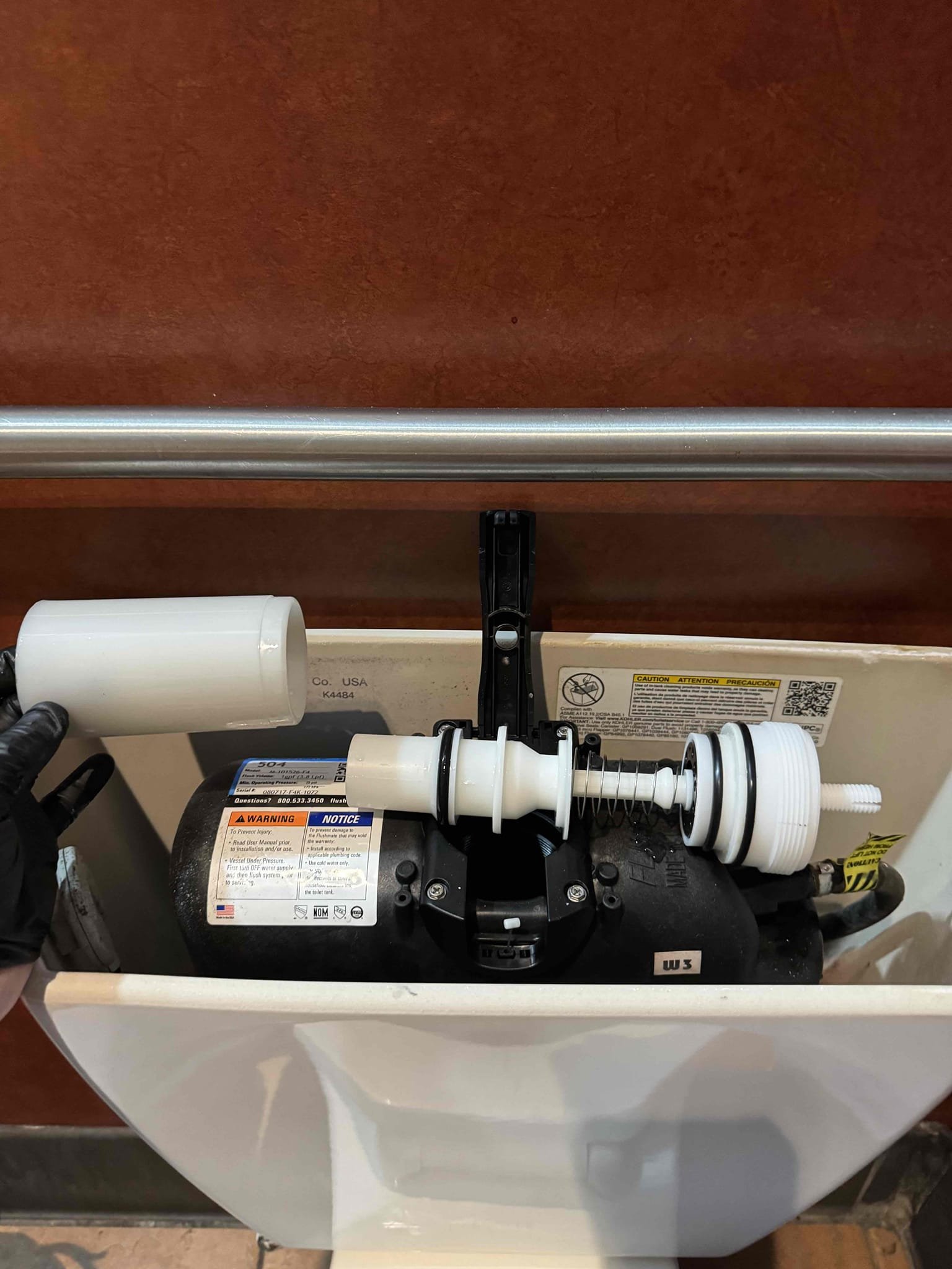 Upon receiving a call about a toilet with reduced flushing efficiency, I began by inspecting the toilet to determine the cause. Using a toilet auger, I ensured the trap was clear of any obstructions. Next, I disassembled the pressure assist flush mechanism to investigate further. Upon examination, I discovered that the flush cartridge was broken, which was the root of the problem. I promptly replaced the broken cartridge with a new one, ensuring it was properly installed. After reassembling the mechanism, I tested the toilet to confirm the issue was resolved. Throughout the process, I was supervised by Manager Lisa, who was present on site. The only part used in this repair was the pressure assist flush cartridge.