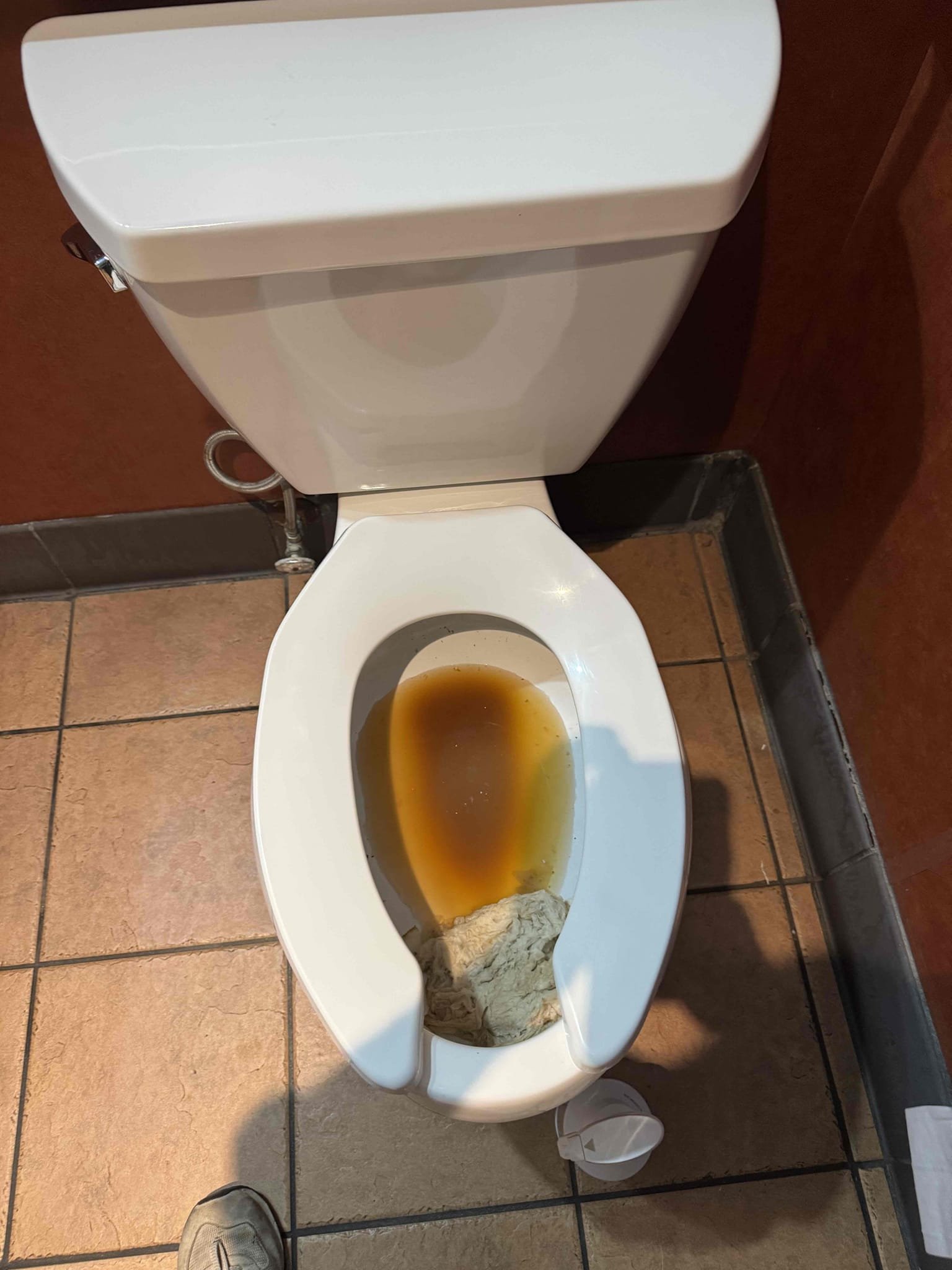 Upon receiving a call about a toilet with reduced flushing efficiency, I began by inspecting the toilet to determine the cause. Using a toilet auger, I ensured the trap was clear of any obstructions. Next, I disassembled the pressure assist flush mechanism to investigate further. Upon examination, I discovered that the flush cartridge was broken, which was the root of the problem. I promptly replaced the broken cartridge with a new one, ensuring it was properly installed. After reassembling the mechanism, I tested the toilet to confirm the issue was resolved. Throughout the process, I was supervised by Manager Lisa, who was present on site. The only part used in this repair was the pressure assist flush cartridge.