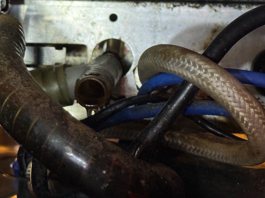 Upon inspection, the drain tray for the espresso machine at the bar had a rubber tube that was disconnected from the other drain parts. To prevent leakage, I reconnected the tube temporarily. The rubber tubing will need to be replaced by the specialized espresso machine technician. I ensured the temporary fix would not cause any leaks, and the store manager will contact the appropriate technician for the replacement. The job was signed off by Jay.