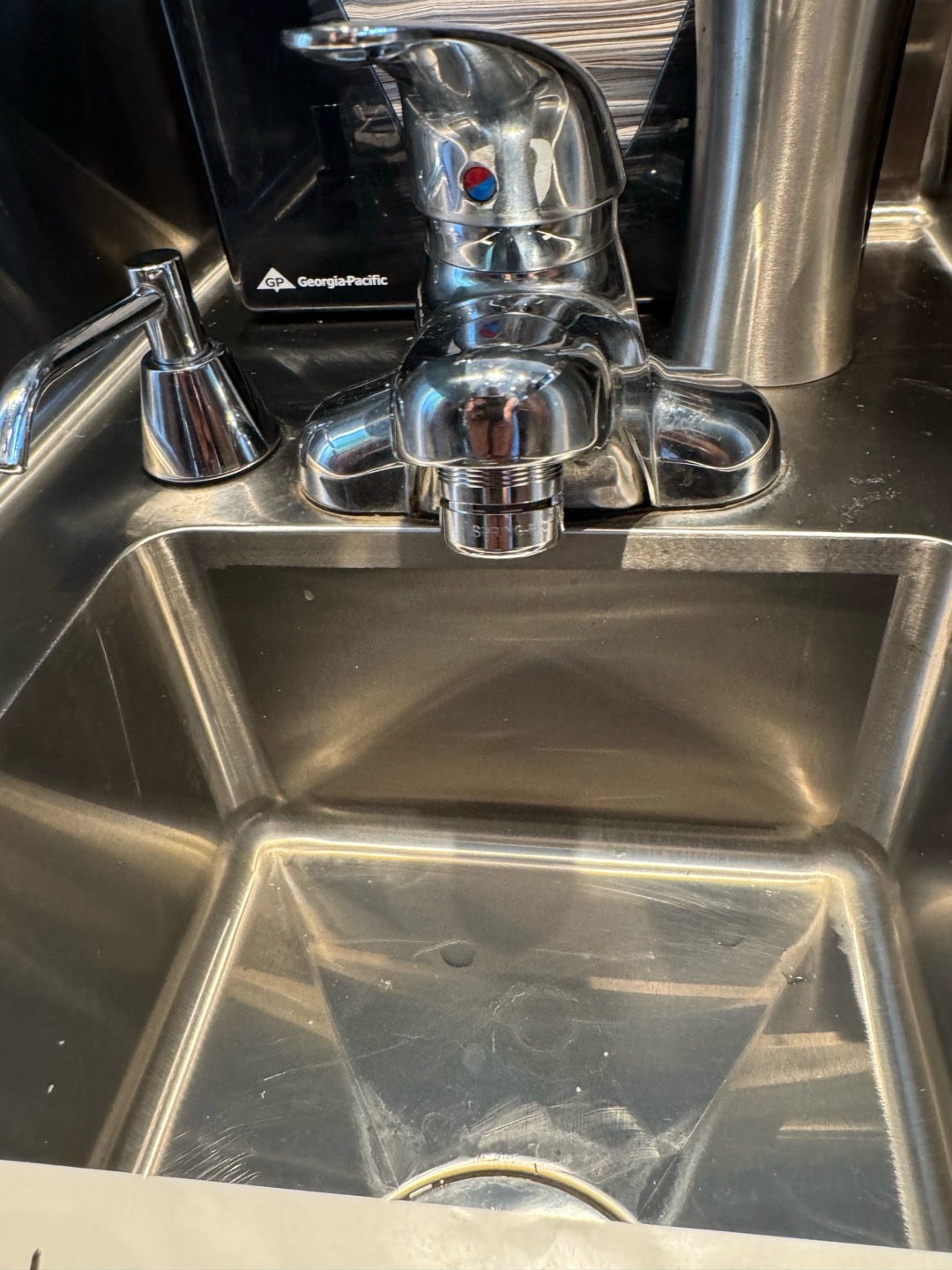 Upon inspection, the hand sink faucet's aerator was found to be broken. I carefully removed the damaged aerator and replaced it with a new one, ensuring a proper fit. The new aerator, a 1-spring flow type, was installed to enhance water flow and reduce splashing. After installation, I tested the faucet to confirm that the water flow was smooth and efficient. The job was completed to ensure optimal functionality and hygiene.