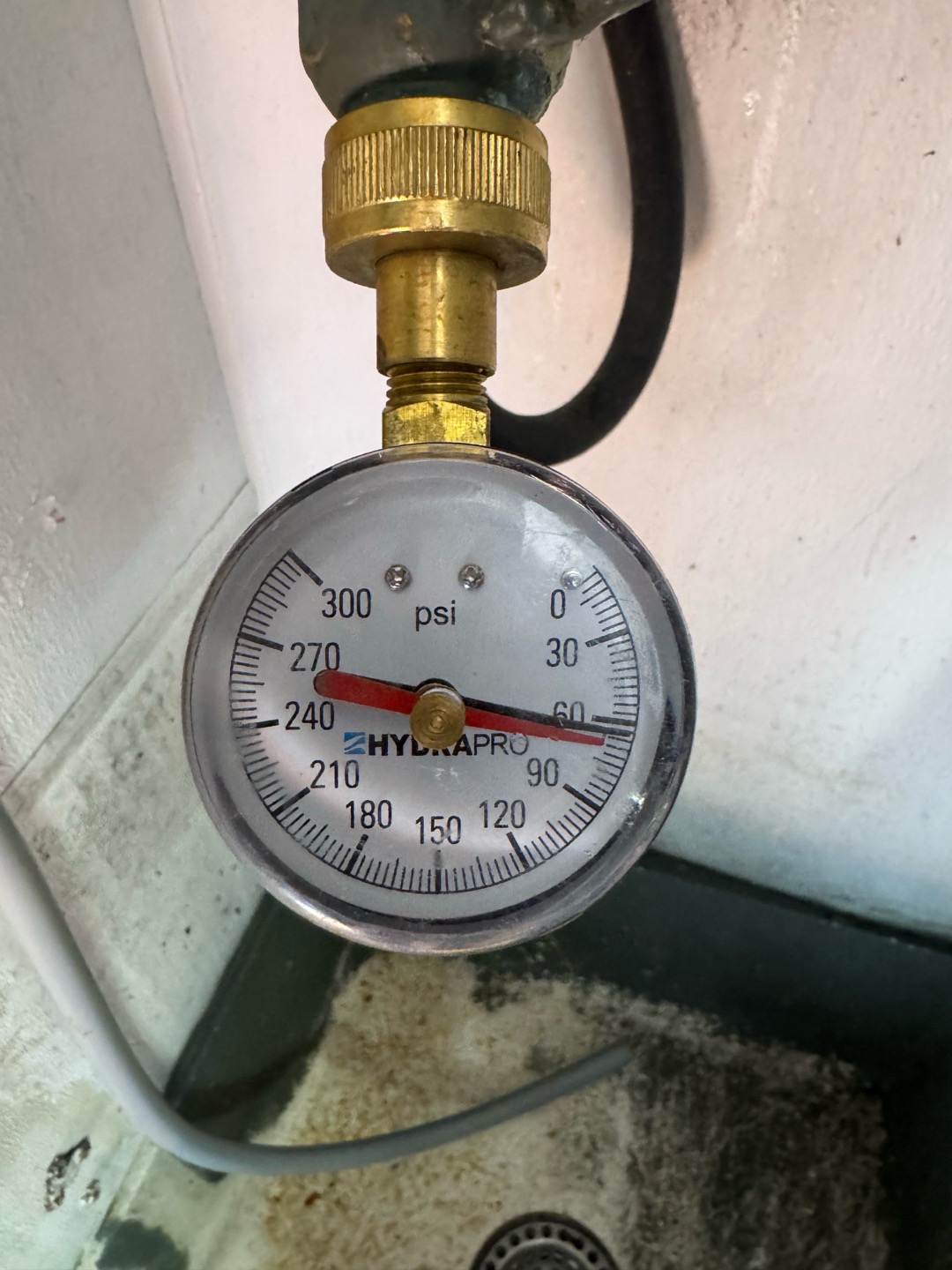 Upon inspection, I identified a small crack in the filter system housing, which was causing water to spray onto the floor. I confirmed the system pressure was at 65 psi, within the normal range. I informed the store manager about the issue and suggested contacting the filter system manufacturer for a replacement. The manager, aware of the supplier, agreed to reach out for a replacement and reconnection of the lines. Additionally, I verified that the previous service provider does not handle such repairs.