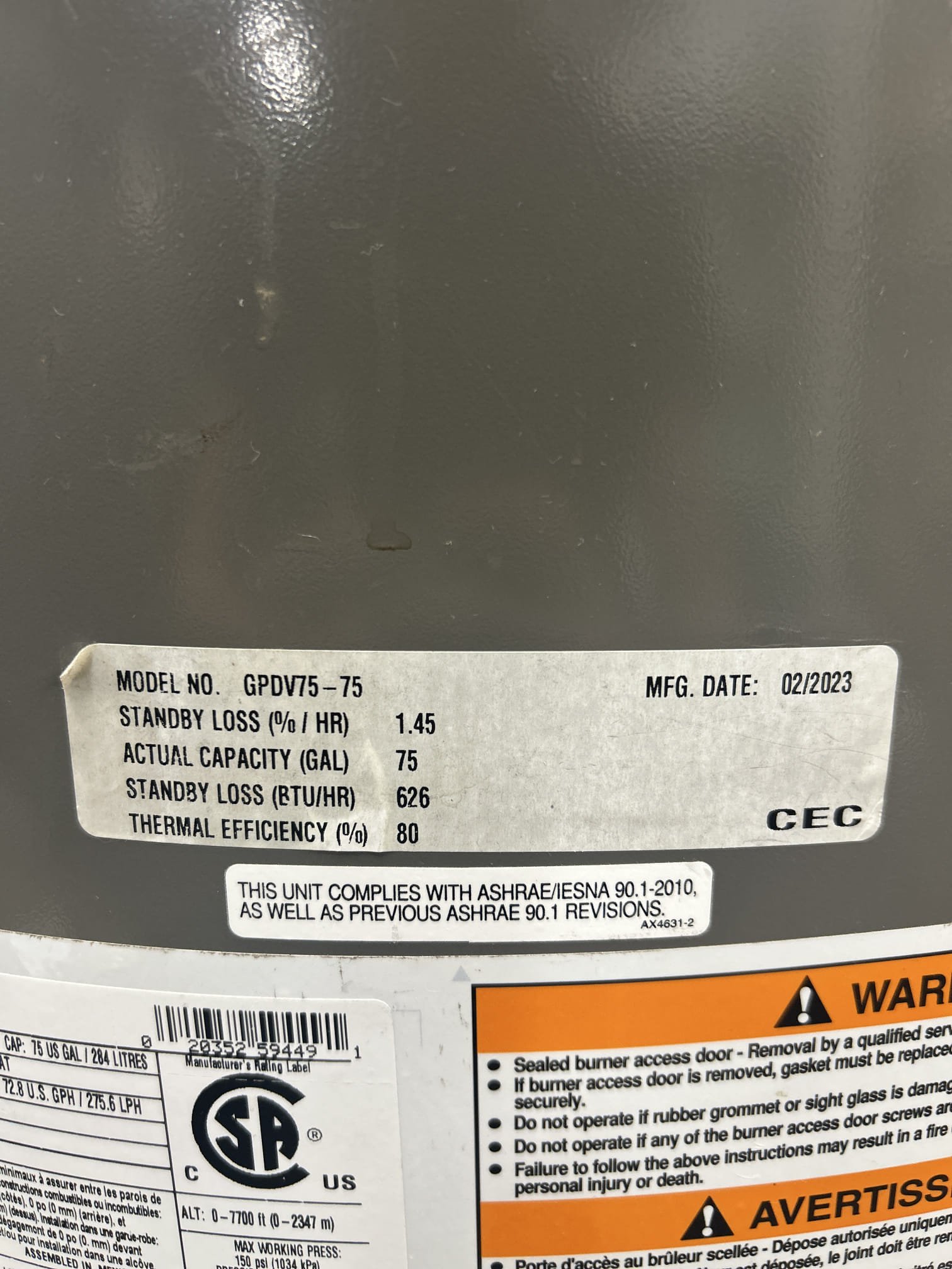 Upon arrival, I took a picture of the water heater and its rating plate for documentation. I then inspected the bathroom lavatory sink on the right, which was experiencing slow drainage. I removed the trap assembly and thoroughly cleaned it to remove any obstructions. After reassembling the trap, I ran hot water for several minutes to ensure proper flow. The sink is now clear and draining effectively, resolving the issue.
