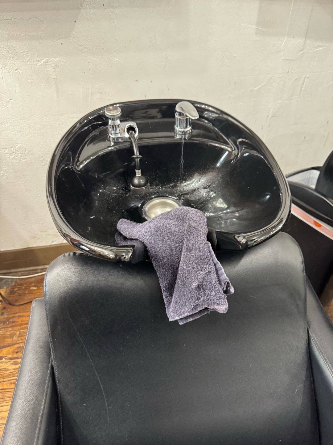 I replaced the drain hose for the shampoo chair. First, I sourced a new flexible rubber hose kit from a local hardware store. After removing the old hose, I installed the new kit, ensuring all connections were secure. I used a 1 1/4x1 1/2 simple drain kit and a 1 1/2 PVC tailpiece for the installation. Once completed, I ran water through the system to confirm the drain was functioning properly. The shampoo chair is now ready for use.