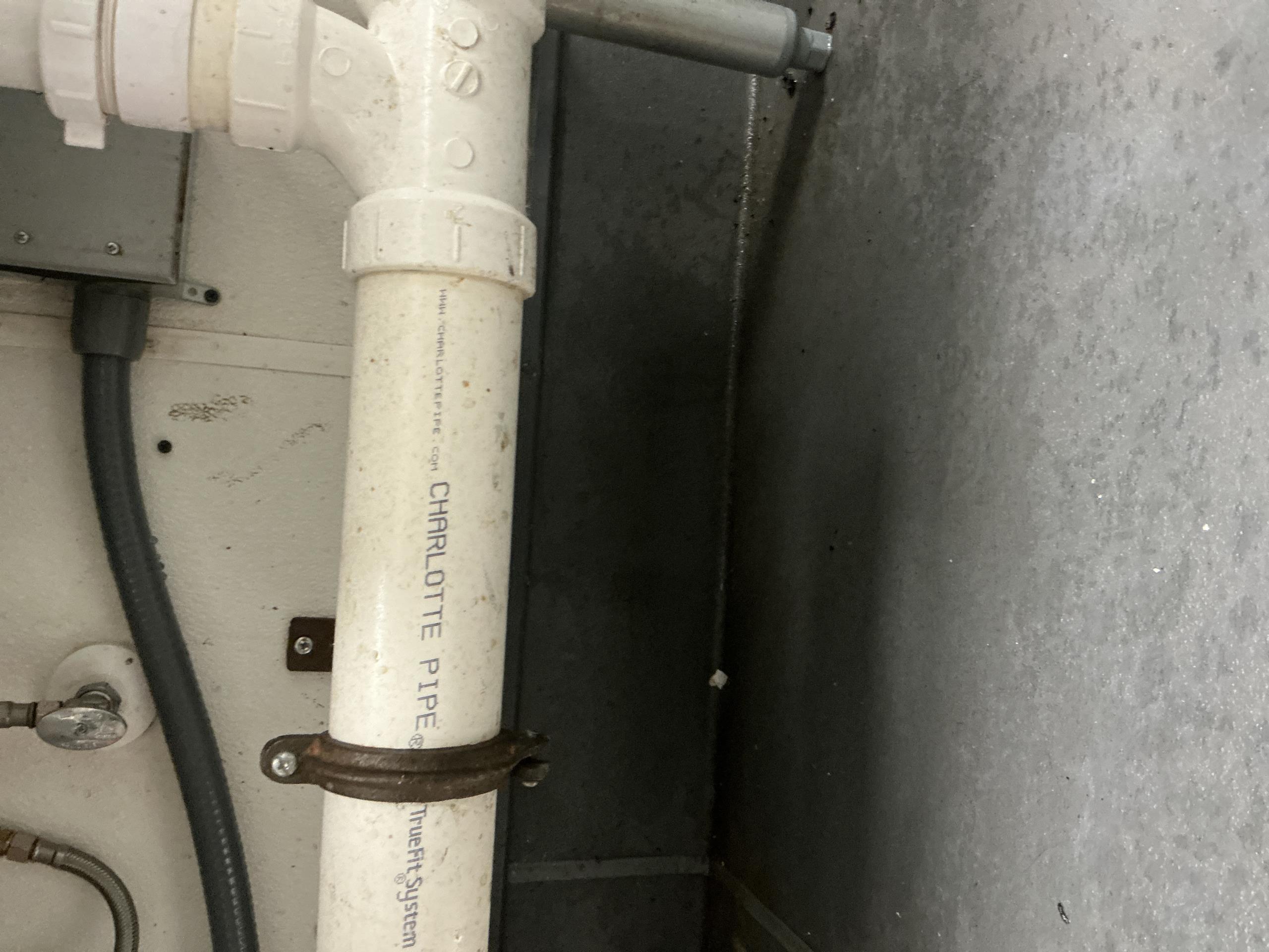 I conducted a thorough inspection of the drainage system and its surrounding area. Upon examination, I identified an extremely loose slip nut on the wash bay of the three-component unit. This loose connection was causing water to drip. I carefully secured the slip nut, ensuring a tight and secure fit. As a result, the dripping water issue has been resolved, and the system is now functioning properly.