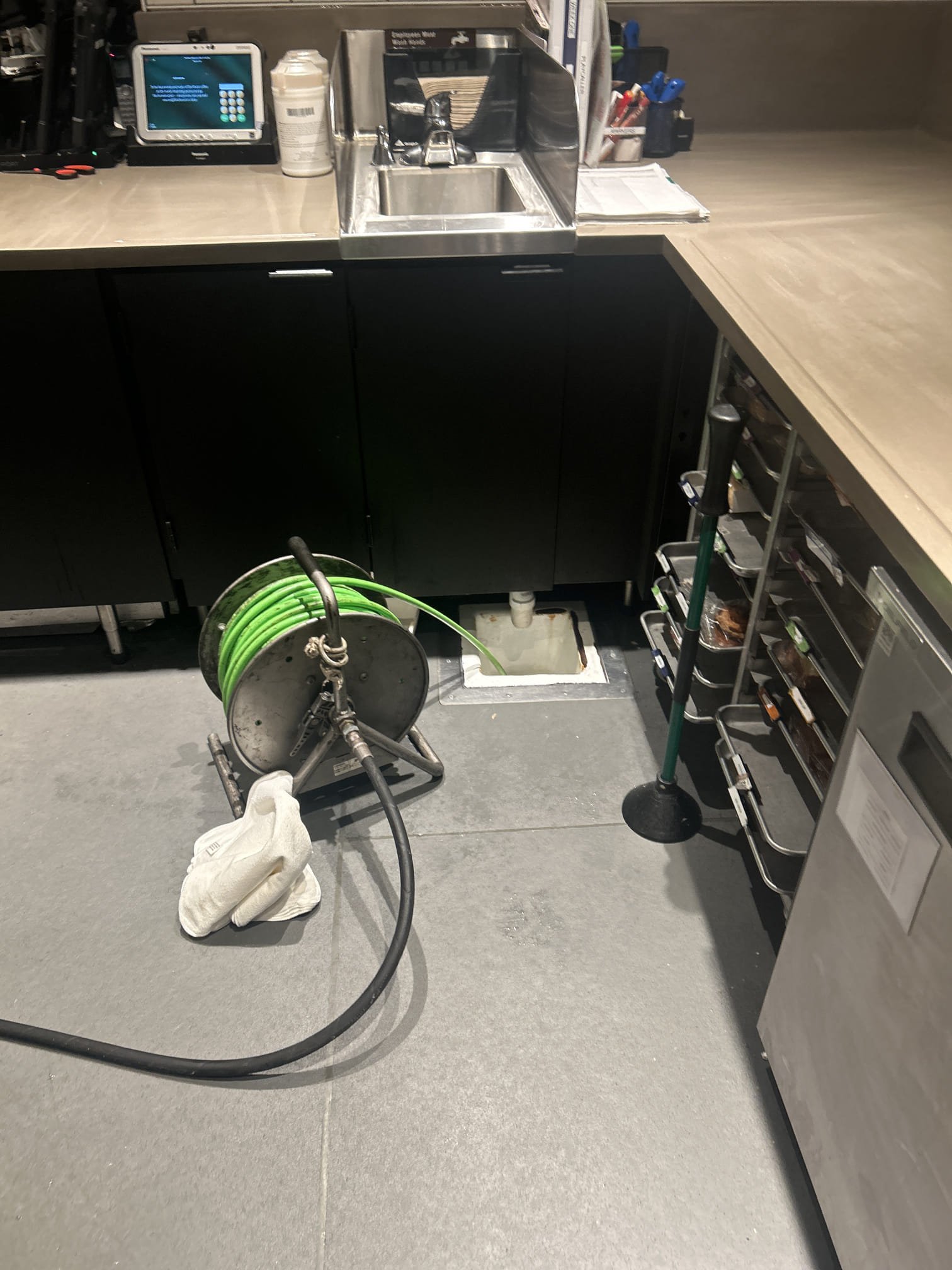 We addressed a recurring issue with slow-draining FOH drains, likely due to coffee and cream residue buildup. After consulting with the manager, we scheduled a service after hours to avoid strong odors. Upon arrival, we jetted the incoming side of the drain line and cleared the buildup from the clean out to the grease trap. Using a small jetter hose, we also cleared floor sinks. Finally, we flushed the system with hot water to ensure all residues were removed, resulting in clear drains.