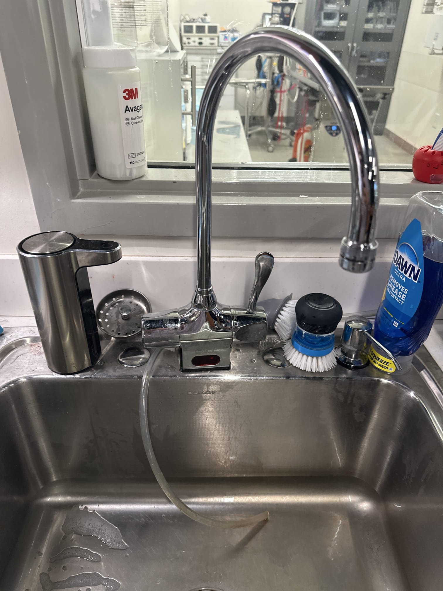 Upon arrival, we discussed the issue with the manager, who pointed out the constantly dripping faucet. The faucet is a Hydrotek 4000c-sd-lr hybrid model, which can be operated by a sensor or a single handle. After inspection, it was determined that the solenoid valve needed repair. We ordered the Solenoid valve repair kit part # HCB-017B from Hydrotek. Upon returning, we disassembled the sensor side of the faucet, replacing all parts with those from the kit. However, the faucet still dripped at a rate of one drop every 6 seconds. Further troubleshooting led us to disassemble the handle side, clean each part, and reassemble. The faucet then dripped at a rate of one drop every 90 seconds. After flipping the main gasket washer, the spout no longer dripped. We advised the manager that if the issue reoccurs, the handle may need a spindle repair kit and to contact us.