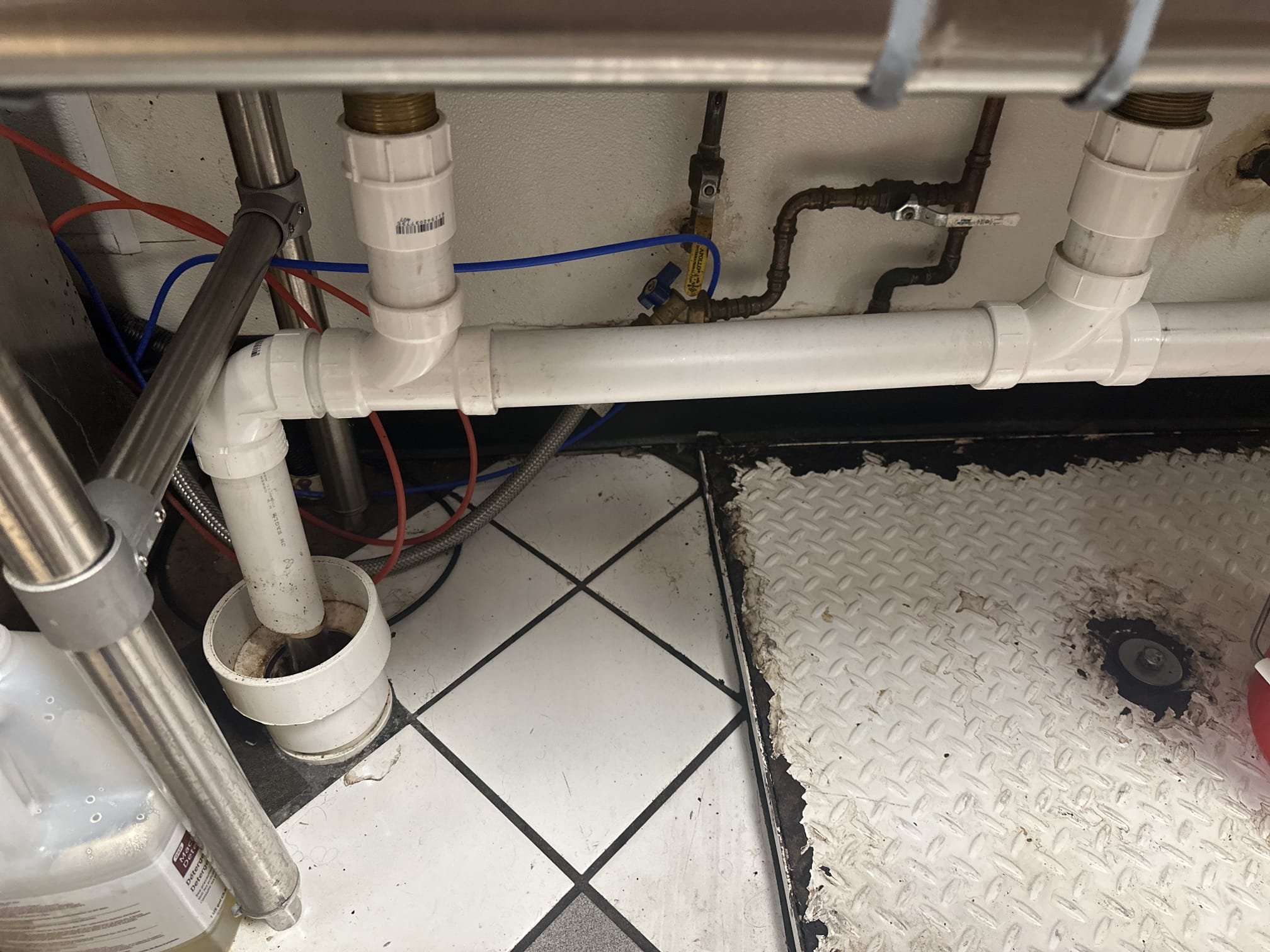 Upon arrival, I inspected the drain for the three-compartment sink. The drain leads into a hub that directly empties into the grease interceptor. Due to the design of the hub for the three-compartment sink, a slight odor was expected. To address this, I treated the hub with Glug, a specialized drain cleaner, applying it twice. This effectively eliminated the smell. I then ran hot water through the drain for several minutes to ensure there were no lingering issues or odors. The treatment was successful, and the system is now functioning properly. Only half of a 20oz bottle of Glug was used for the job.
