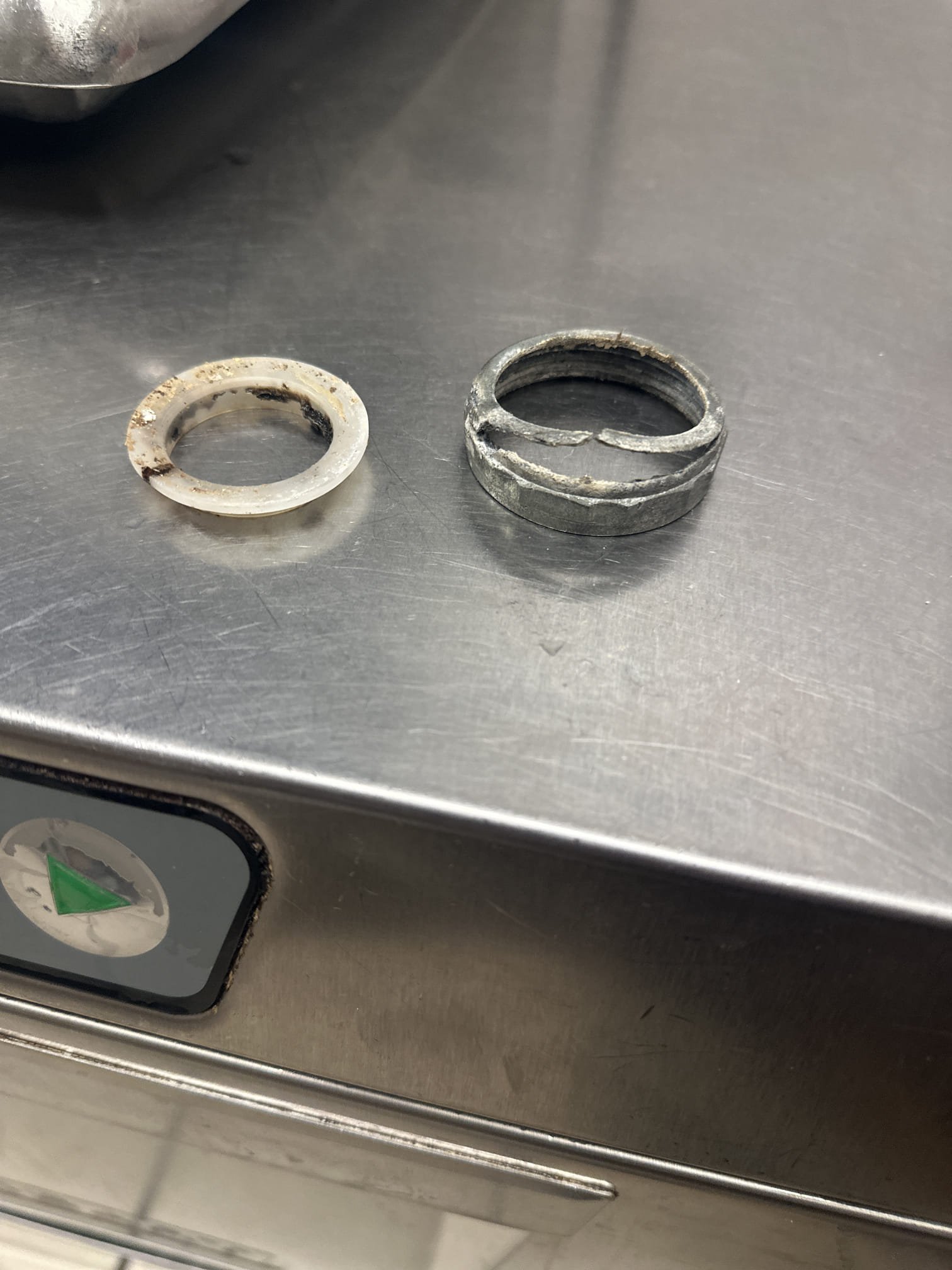 Upon inspection, the hand sink's brass nut had split, causing water to bypass and drip onto the floor. I removed the tail piece and the broken brass nut. A new 1-1/2 inch brass nut and a top hat gasket were installed. The drain was secured, and a test confirmed that the leak was resolved. The job was completed using a brass nut and a top hat gasket.
