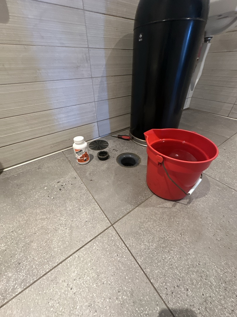 Upon arrival, I inspected the floor drains and hand sink drains in both bathrooms. Although no clogs were detected, a faint odor was present. I removed the floor drain covers and applied Glug to the drains. After flushing with several buckets of warm water, the odor was completely eliminated. The job was completed using a half jug of Glug, ensuring the drains were thoroughly cleaned and free of any unpleasant smells.