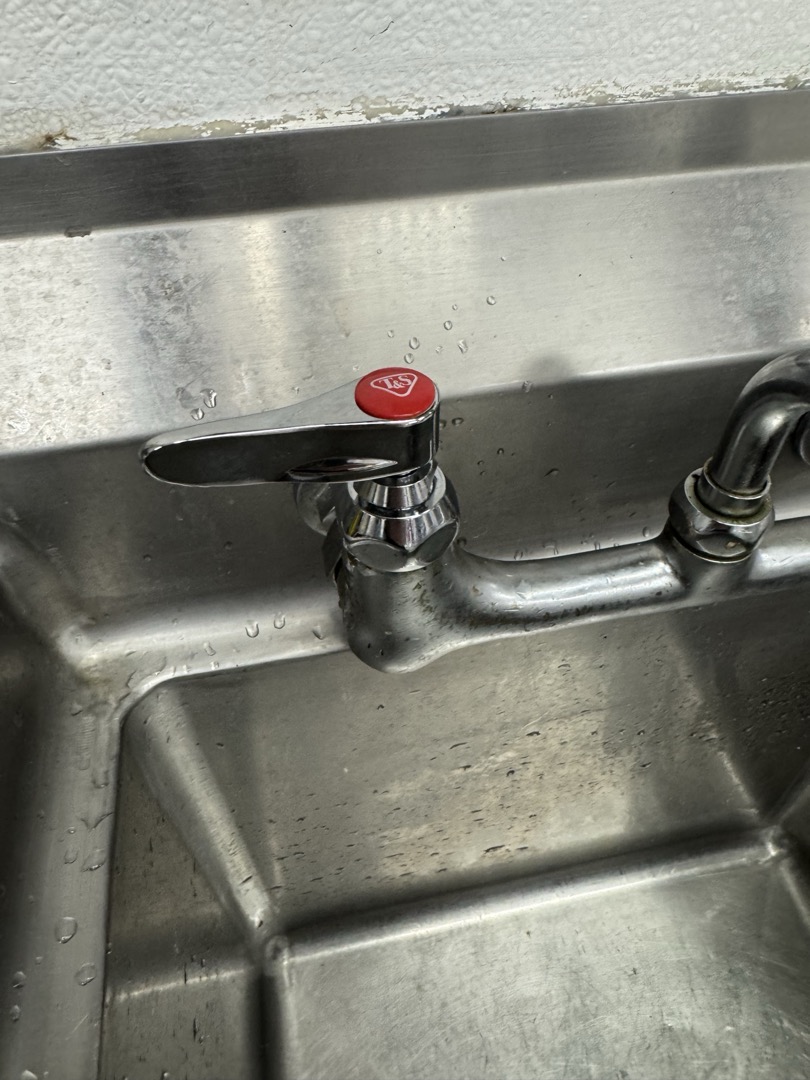 Upon inspection, the hot spindle on the pre-sink faucet was found to be broken, affecting water flow. I promptly replaced the faulty hot spindle with a new one that included a handle for easier operation. The new spindle was carefully installed, ensuring a secure fit and proper alignment. After the replacement, I tested the faucet to confirm that both hot and cold water flows were restored and functioning correctly. The job was completed efficiently, and the faucet is now fully operational.