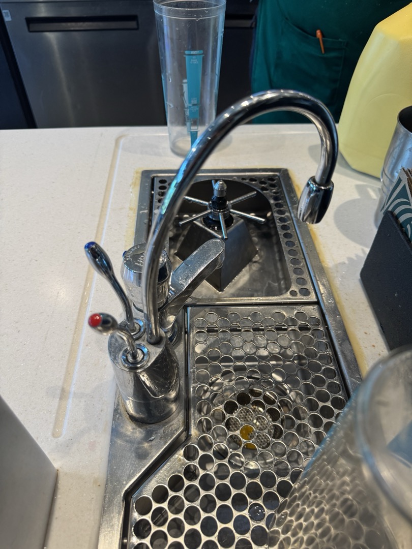 Upon arrival, I identified that the instant hot water faucet was experiencing a dripping issue on the hot side. I began by adjusting the packing nut to ensure a proper seal. After making the necessary adjustments, I ran the hot side to test the faucet's functionality. I observed the faucet closely to confirm that the dripping had ceased. The manager then proceeded to test the faucet multiple times to ensure it was working correctly and without any issues. The faucet was found to be in good condition and did not require replacement. I verified that the faucet was operating properly and signed off on the job for Amanda.