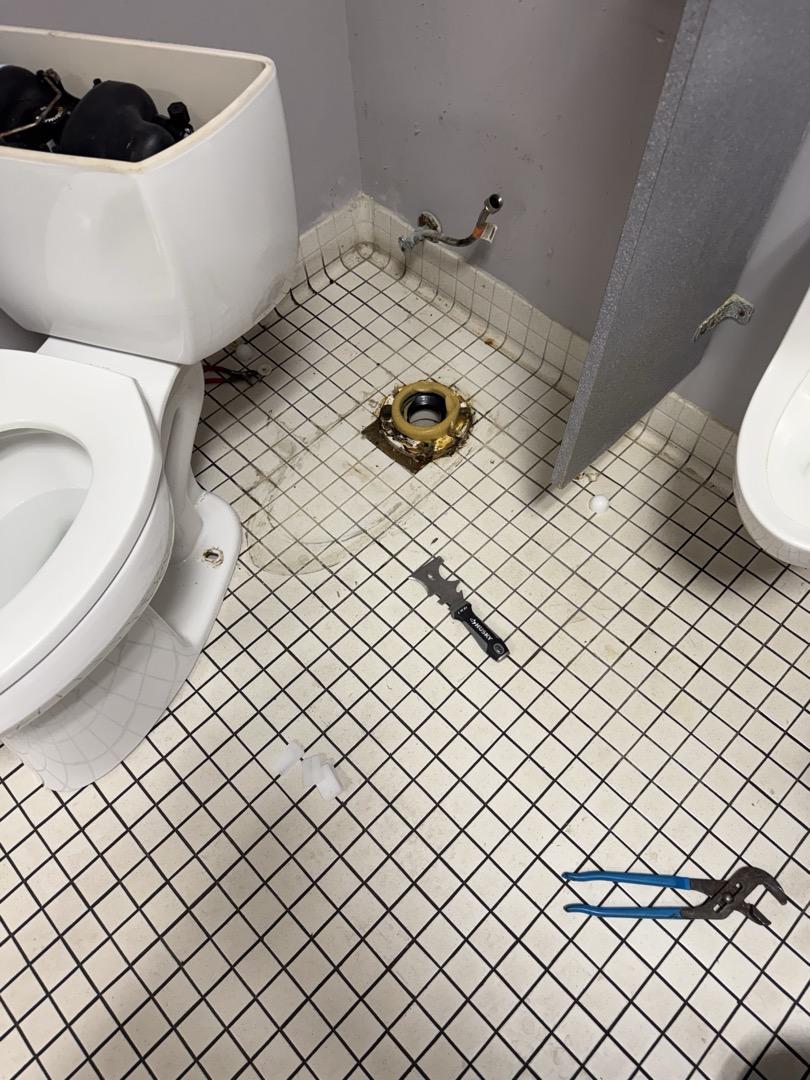 Upon inspection, I discovered water leakage near the toilet. I turned on the water and flushed, observing water seeping from the back at the base. I removed the toilet, cleaned the old silicone from the floor and base, and scraped away the deteriorated wax ring. A new wax ring was installed, and the toilet was reset using four new plastic shims with the existing closet bolts. I reconnected the supply line, turned on the water supply, and tested the toilet. Finally, I sealed around the base with clear silicone. Manager Gail was present during the work. Parts used included a wax ring, four plastic shims, and clear silicone.