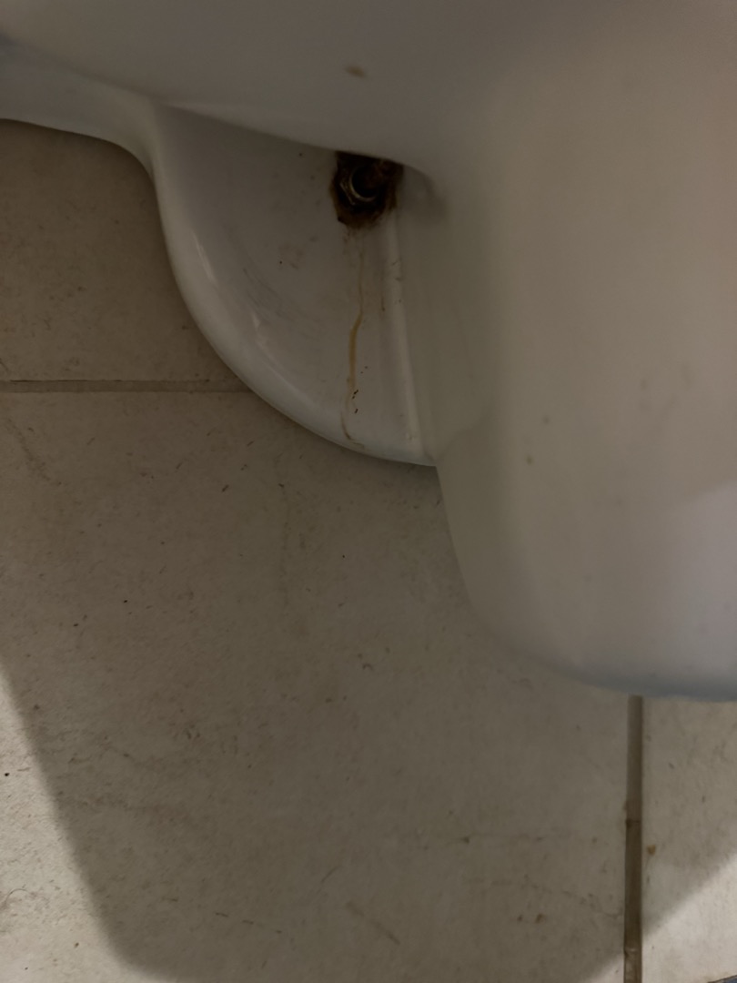 Upon inspection, the large urinal on the left side was leaking from the bolts securing it to the drain. Despite tightening the bolts to their maximum capacity, the issue persisted. Consequently, the wax ring needed replacement. I removed the urinal, cleaned the area, and installed a new wax ring. However, after securing the urinal and turning the water back on, leakage reappeared from the bolt holes. This indicated the urinal itself needed replacement. I informed the manager and scheduled a return visit with an additional person to replace the urinal using an American Standard Lynbrook urinal and a foam ring.