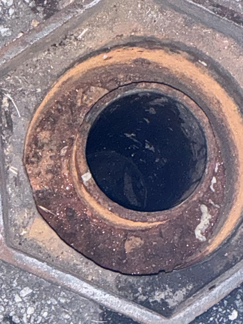 I responded to two calls, one of which was an emergency jetting service. Upon arrival, the main drain was experiencing significant backup. I first removed the test port lid and discovered it was full, with the clog located after the test port. I used the drain machine in the cleanout after the test port to clear the clog. After successfully unclogging the drain, I flushed the toilets in both restrooms, which now flushed properly without any floor drains backing up. Later, I ran the jetter in the test station, pushed the camera until it met the main sewer tee, and recorded and inspected the pipe. A significant clog was found where the restrooms tee into the side of the line. I cleared the clog and ran the jetter from the cleanout at the building edge, followed by another camera inspection to ensure everything was clear.