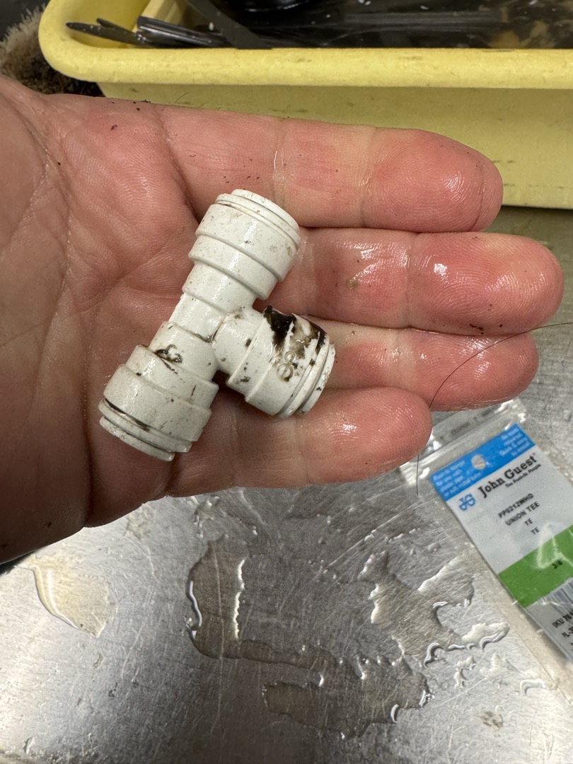 Upon inspection, I identified a damaged push fitting on the cold water line connected to the dishwasher, which was causing a noticeable leak. To resolve this issue, I carefully disassembled the affected area, ensuring minimal disruption. I then replaced the damaged 1- 3/8x3/8x3/8 push fitting with a new one, ensuring a secure and leak-proof connection. After reassembling, I tested the system to confirm that the leak was completely resolved and that water flow was restored. The dishwasher is now functioning properly, and the risk of further damage has been eliminated.