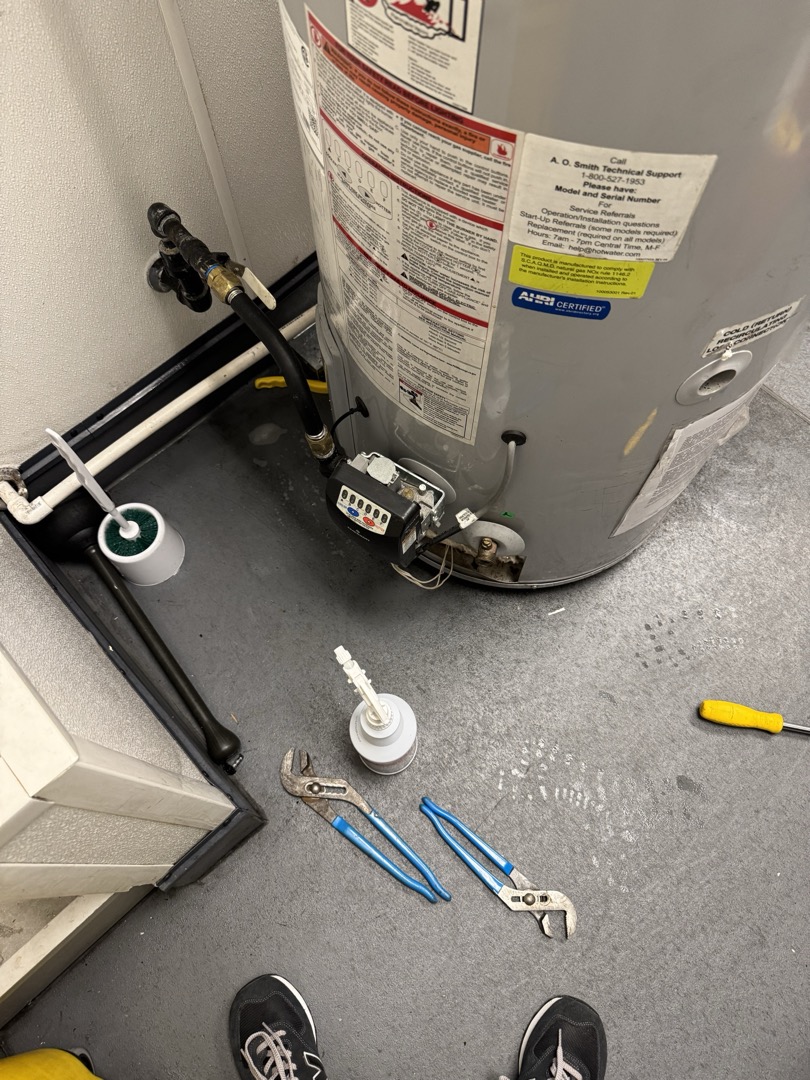 Upon arrival, I entered the closed store using my access. The alarm code failed, so I canceled it after it sounded. I found the water heater off and the gas shut off at the ball valve. I sprayed down the gas lines and whip, then turned on the gas and heater. The heater fired up, but no bubbles were detected, so I turned it off and tightened all gas connections. I also checked and tightened the exhaust connections, ensuring the condensation plug was draining. I cycled the heater multiple times with a flammable vapor detector, which never tripped. I left the heater and gas on to attend another work order, returning later to test again with the detector and my senses.