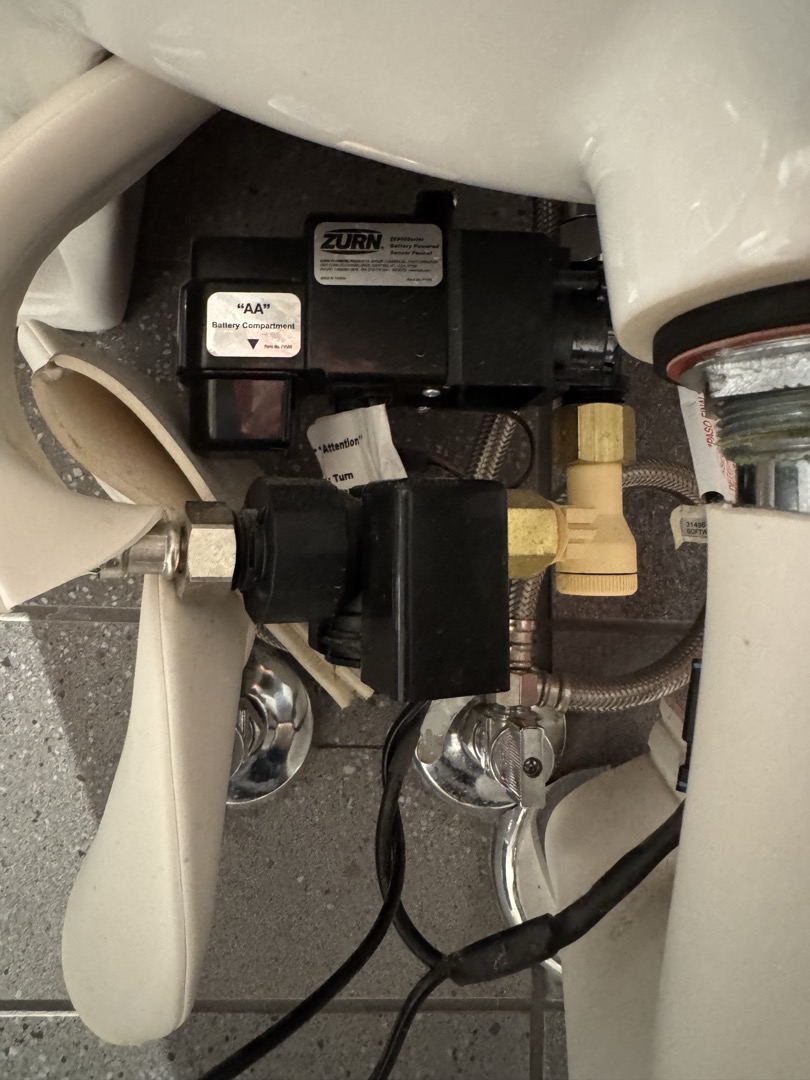 Upon arrival, I identified that the Zurn sensor faucets were experiencing constant on-off cycling in both bathrooms. After thorough inspection, I discovered the Hydro-X Power hydrogenerator was improperly installed. Removing this component resolved the issue, and the faucets are now functioning correctly. This installation method is not standard for regular battery-operated faucets. The job was completed efficiently, ensuring the system operates as intended.