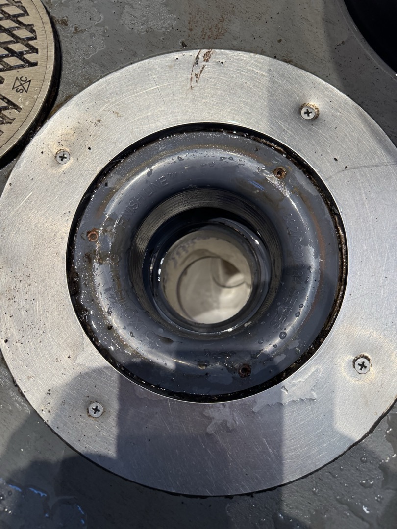 Upon arrival, I identified a clog in the drain line from the cold bar. I accessed the clean-out point and used a mechanical device to dislodge the obstruction. After successfully clearing the clog, I ran the machine further to ensure the line was fully open. To confirm the line's patency, I flushed it with multiple buckets of hot water. I advised the team to run hot water while cleaning the dump sink to prevent future buildup. Post-completion, I cleaned up any mess created during the process. The job was signed off by Ryan.