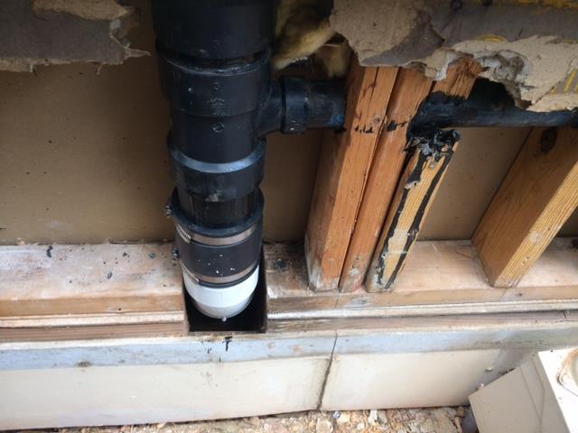 Cut out leaking section of 3" ABS drain line behind kitchen sink and repiped with PVC. Checked other plumbing