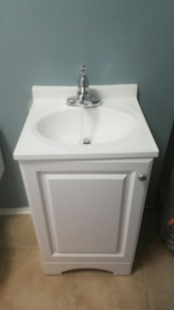Replaced a wall hung sink with a vanity