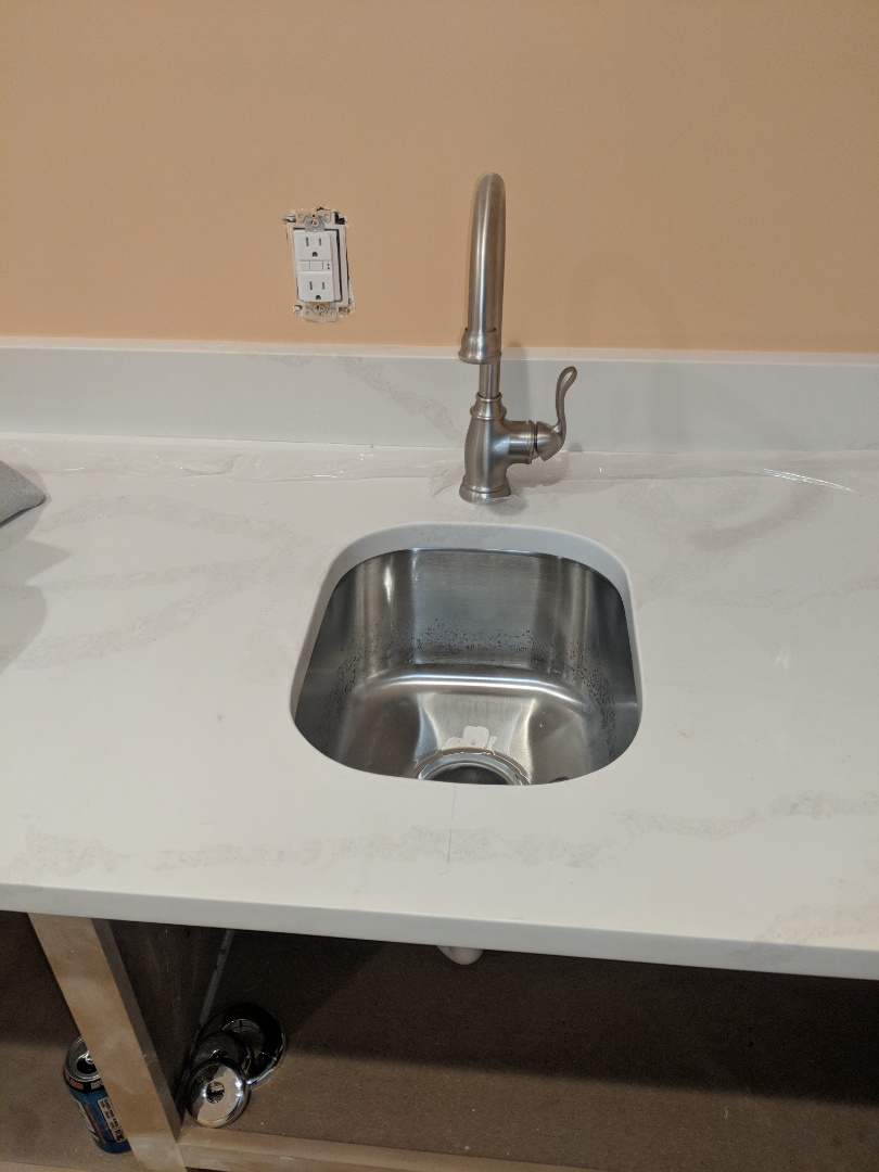 Installed new bar sink and toilets in new construction home