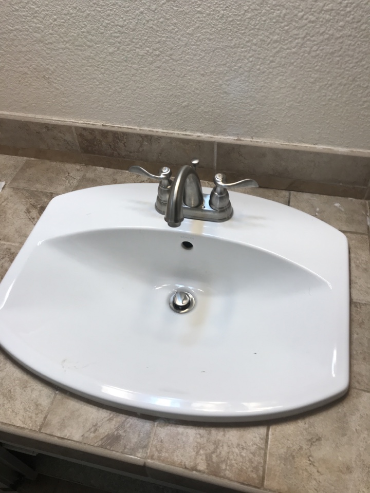 Install lavatory faucet