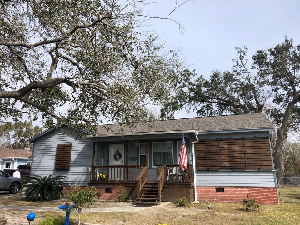 Gulfport, MS - This adorable one story cottage took roof damage during the wind gusts of hurricane Zeta. B&M Roofing was able to replace their old, damaged three tab shingle roof with a brand new GAF timberline HDZ architectural shingle in Weather wood. Gulfport, MS - This adorable one story cottage took roof damage during the wind gusts of hurricane Zeta. B&M Roofing was able to replace their old, damaged three tab shingle roof with a brand new GAF timberline HDZ architectural shingle in Weather wood.