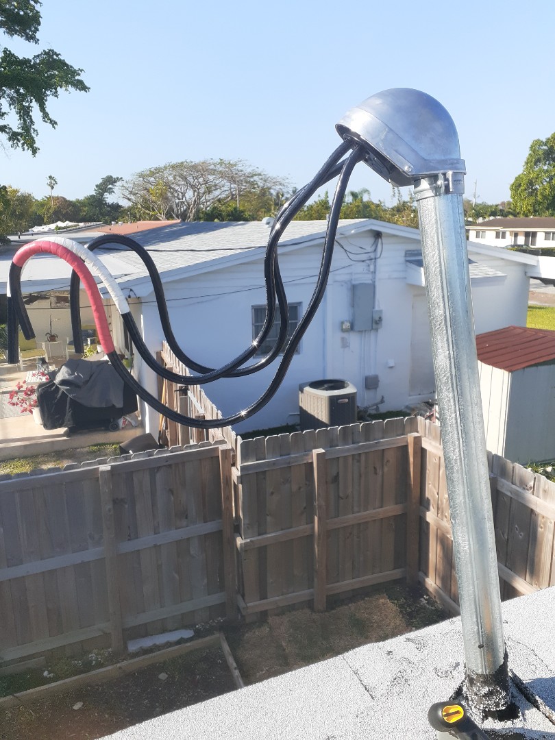 Miami, FL - New weatherhead and wire replacement feeding power to home. Miami, FL - New weatherhead and wire replacement feeding power to home.