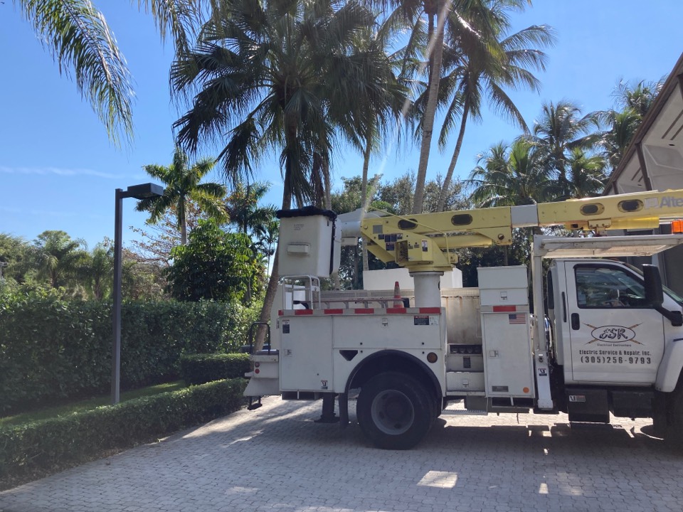 Installing new electrical parking lot pole and light.  Licensed Electrician in Pinecrest, FL.