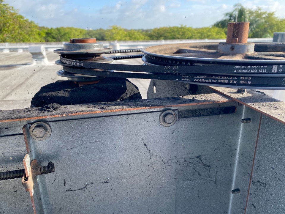 Replacing rooftop exhaust fan drive belts and preventive maintenance on fan units