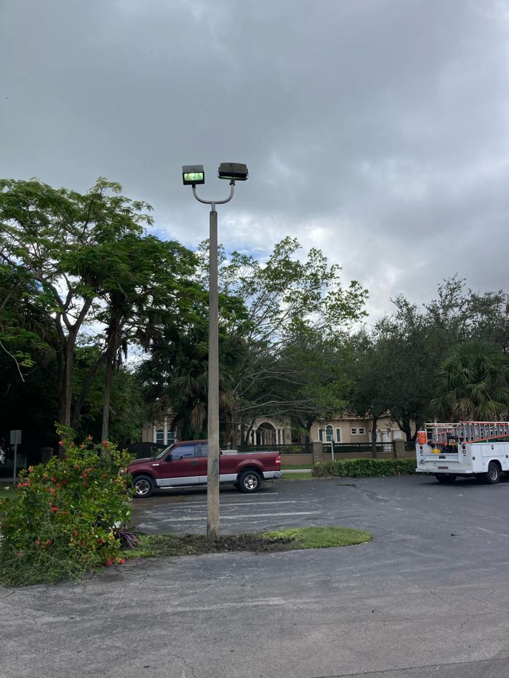 Straighten parking lot pole and restored power to pole Straighten parking lot pole and restored power to pole