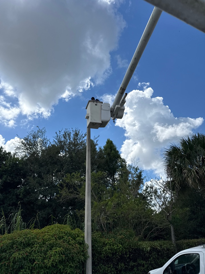 Removing old parking lot lights and adding new LED parking lot lights.