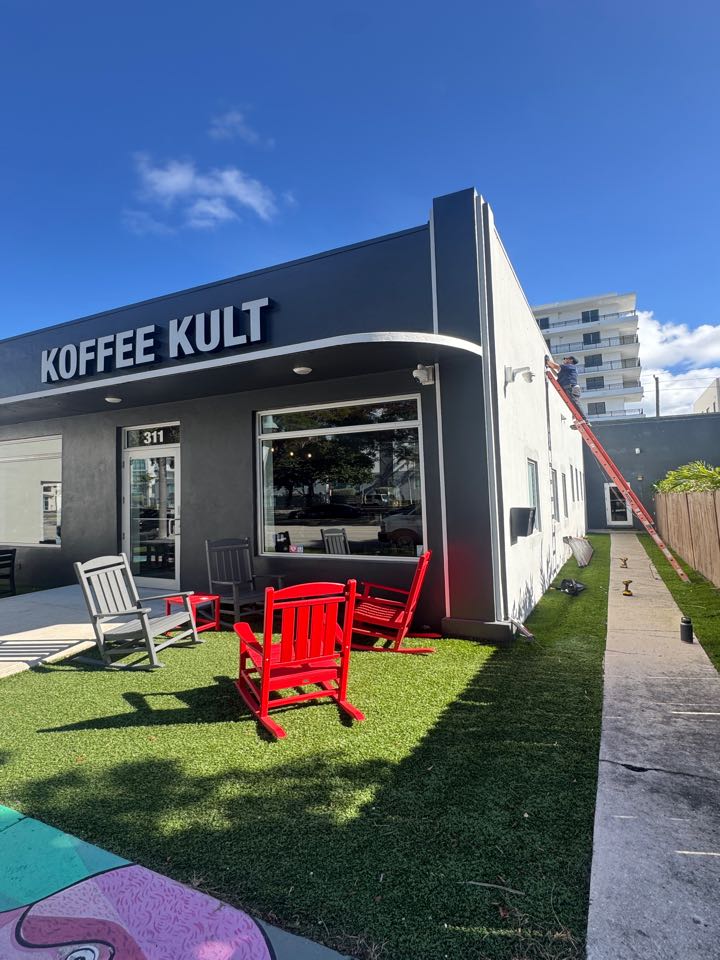 Installing new outside lights for coffee kult