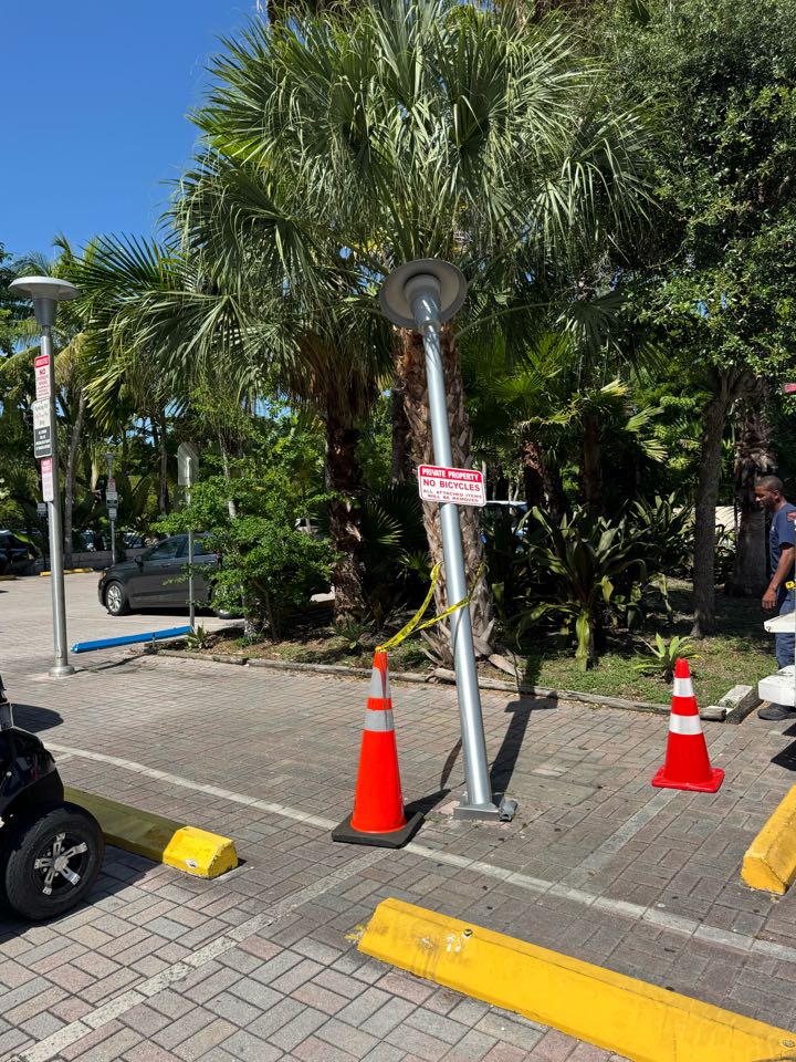 Key Biscayne, FL - Removed aluminum parking lot pole in Key Biscayne Fl . Safe-off wires and electrical connections at pole base.