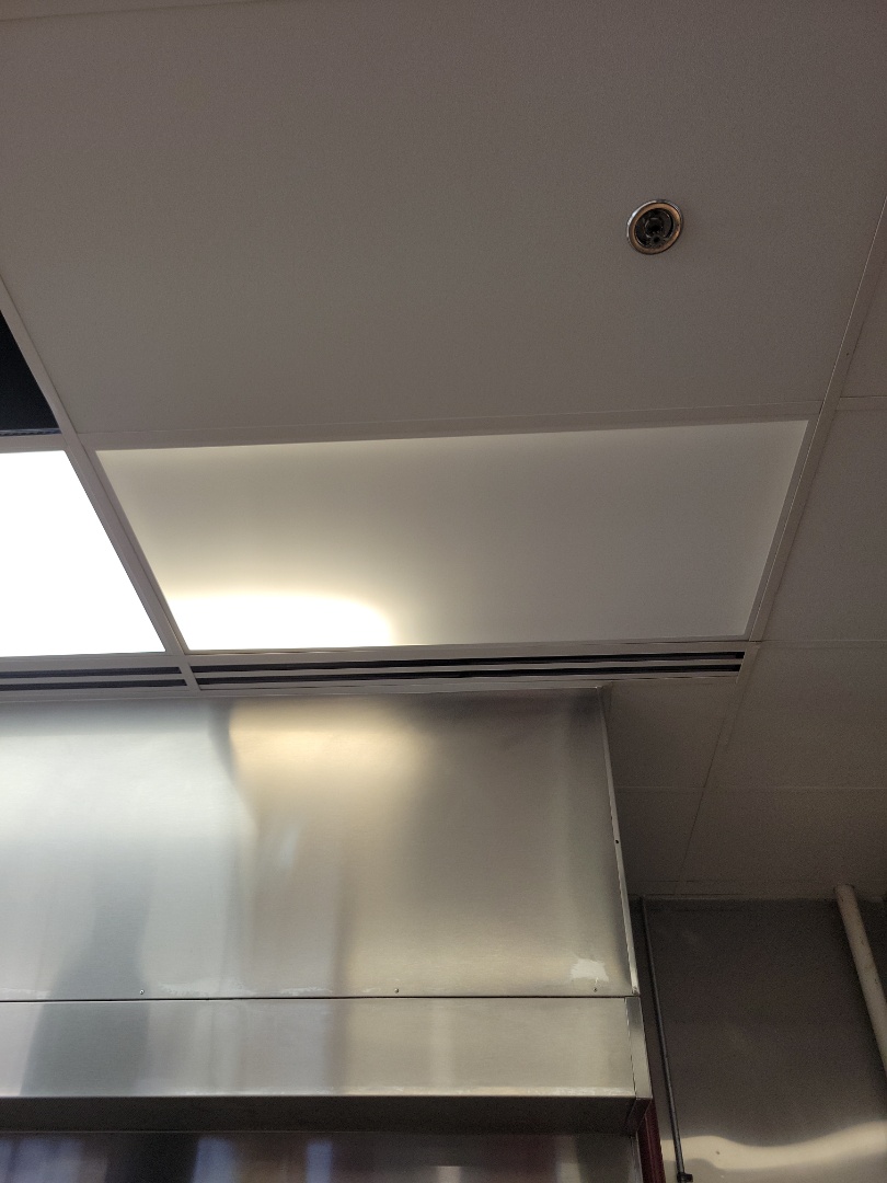 replaces 2x4 LED panel light fixture in five guys in Kendall,Fl 33186
