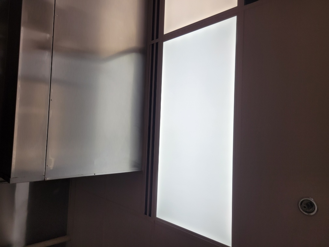 replaces 2x4 LED panel light fixture in five guys in Kendall,Fl 33186