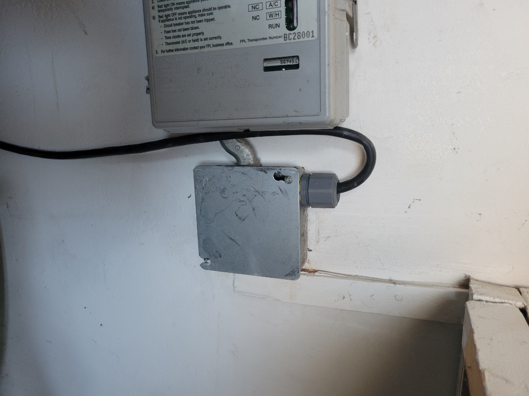 Hollywood, FL - customer had a burn outlet and water heater cord burned. cut burn section and removed outlet and wired directly to power.

