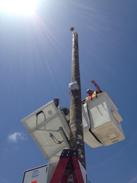 Miami Electrical Contractor installing a solar powered camera at the Port of Miami. 