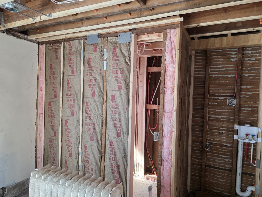 this 1920s home in Kansas City Missouri, needed insulation badly. The old, degraded, mouse infested insulation in the crawl space and exterior walls is getting updated to open cell and closed cell spray foam. They are also getting some much-needed sound deadening between restrooms and bedrooms. 