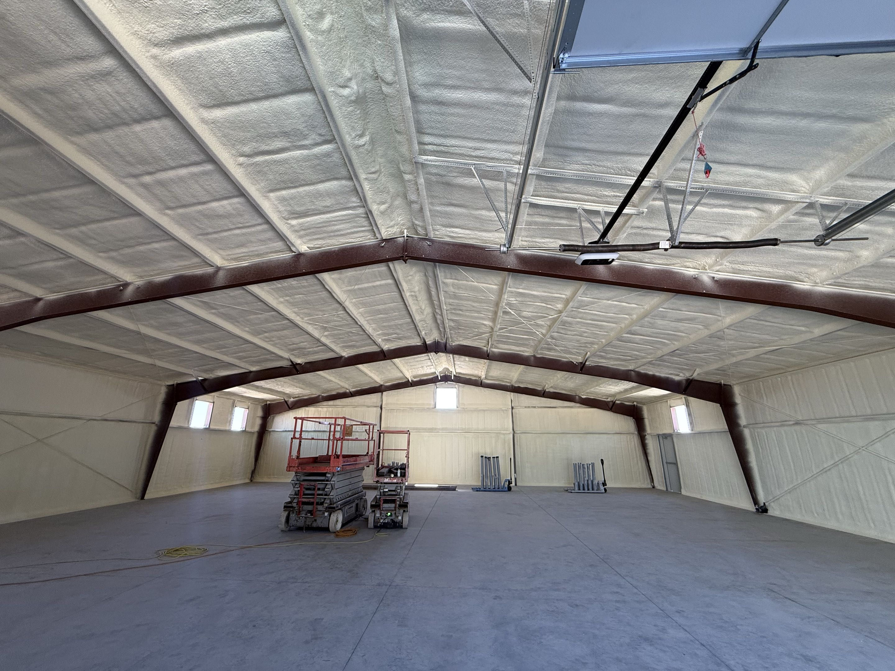 Repeat customer asked us to insulate his metal building shop with 2 inches of close cell roof deck, and walls.