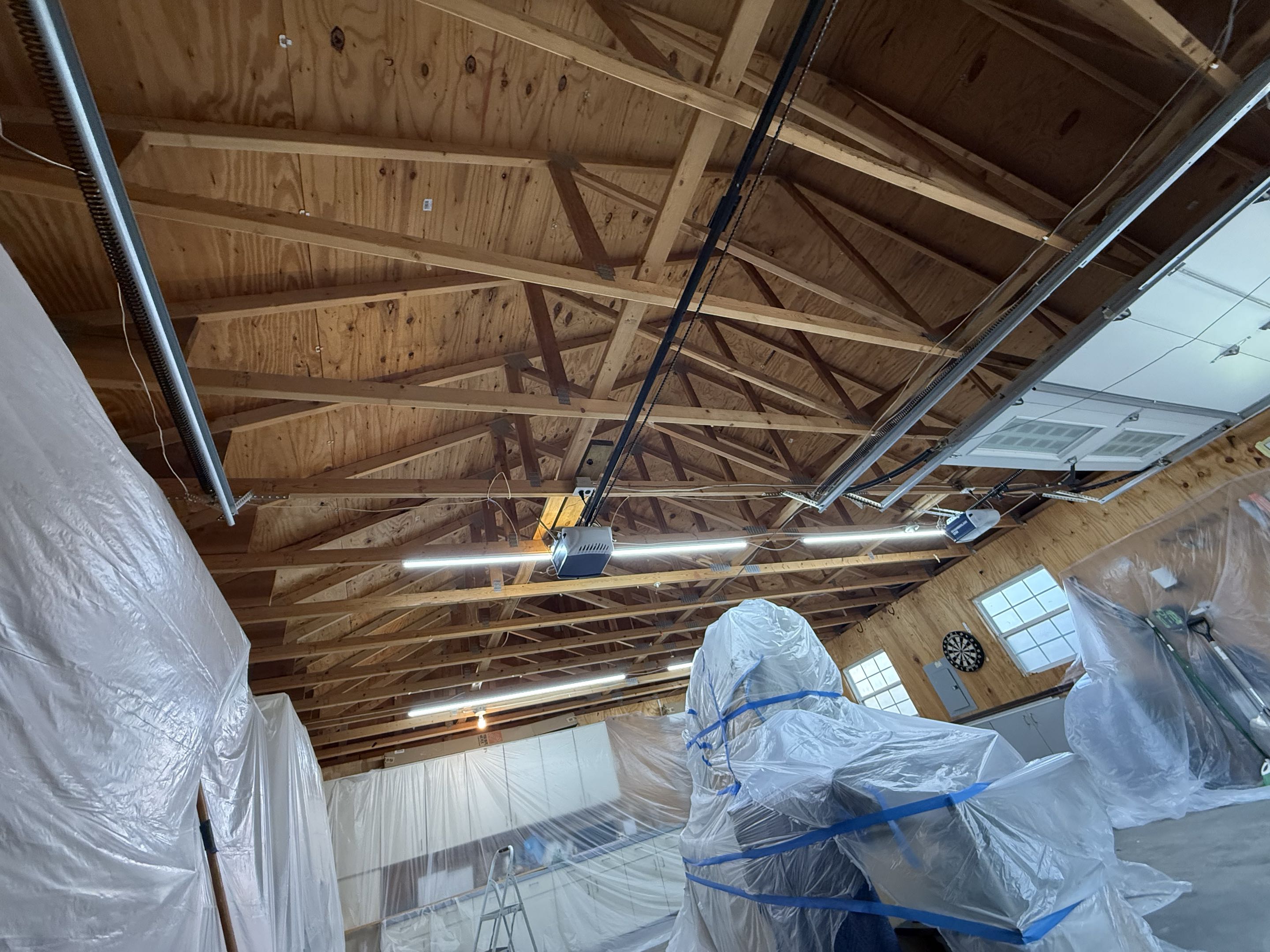 Kansas City, Kansas customer work shop garage was uncomfortable to work in so they asked for a solution. We came in with 8 inches of open cell and a fire proof retardant paint.